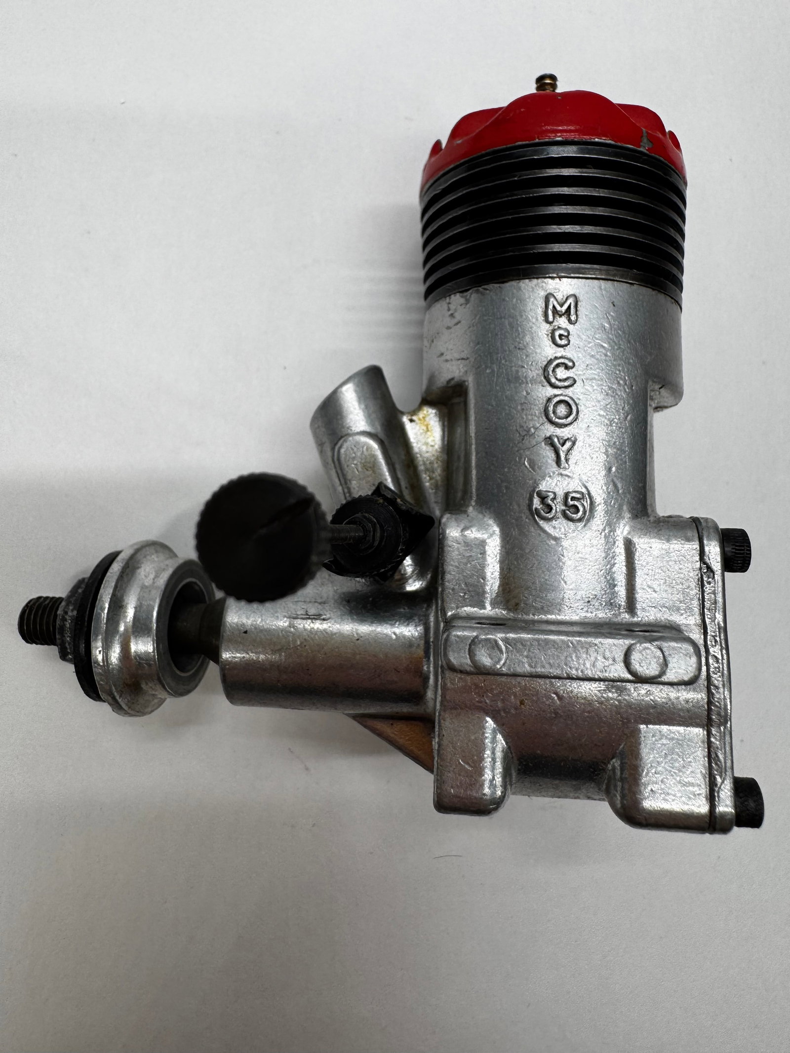 Vintage McCoy .35 Glow Model Airplane Engine RC Motor: Vintage McCoy .35 glow fuel model airplane engine with original red cylinder head. Features a cast aluminum crankcase marked McCoy .35, making it a desirable engine for RC and control line aircraft co
