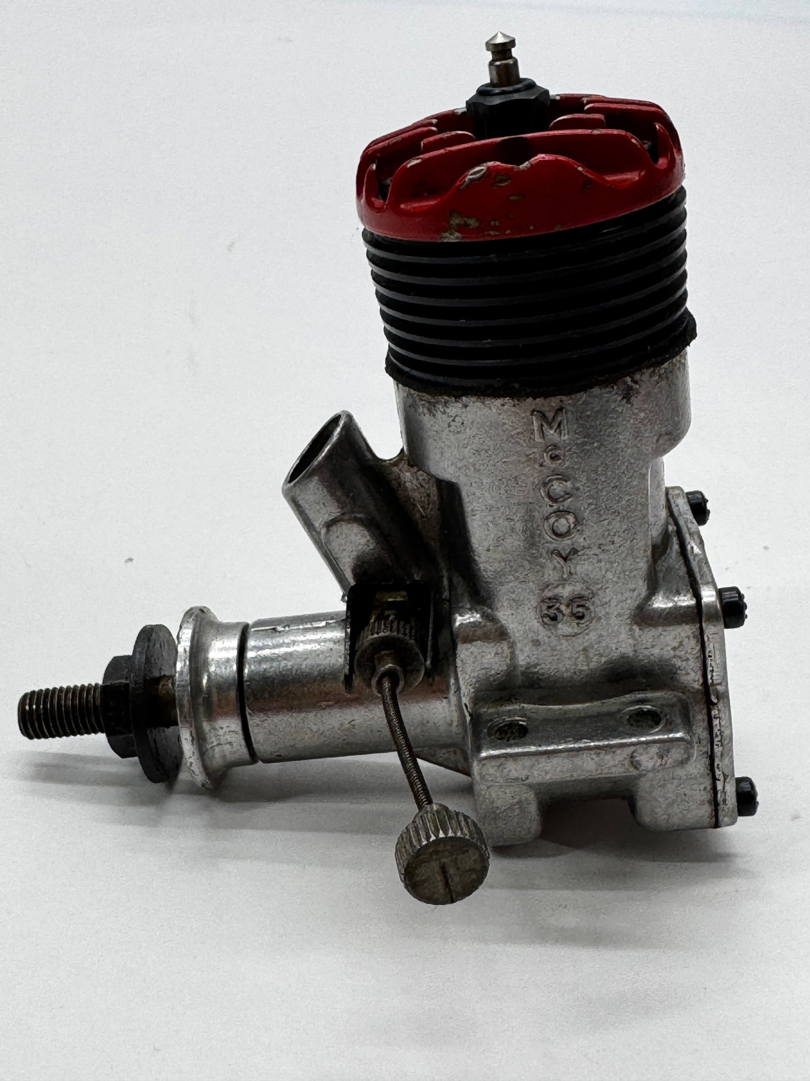 Vintage McCoy .35 Glow Model Airplane Engine RC Motor: Vintage McCoy .35 glow fuel model airplane engine with the original red cylinder head and cast aluminum crankcase. A classic American-made engine used in control line and early RC aircraft. Features t