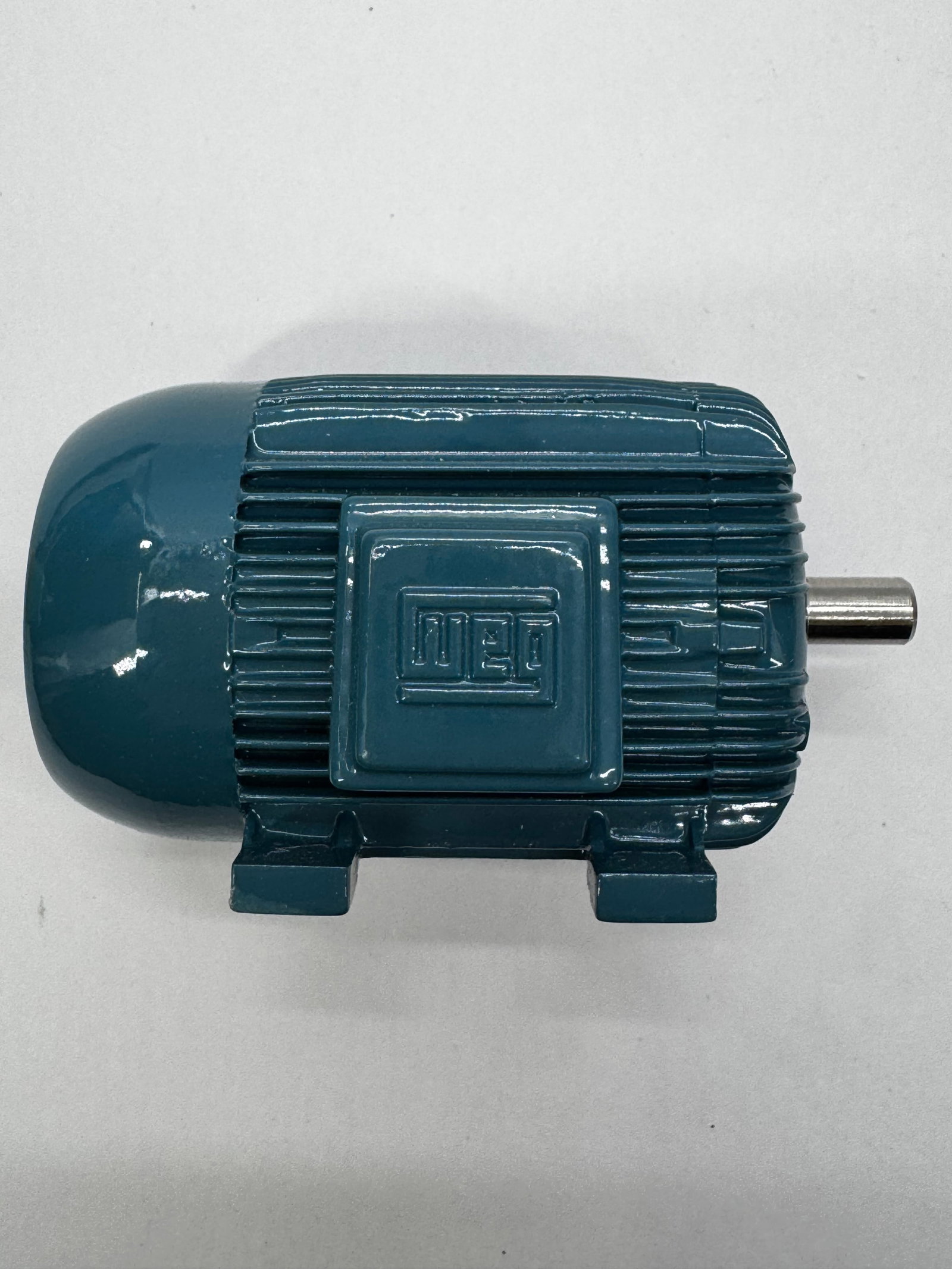 WEG Electric Motor Salesman Sample Display w/ Box: WEG electric motor salesman sample or promotional display model featuring a detailed cast housing with the raised WEG logo and a rotating shaft. Finished in the company’s signature blue-green color 
