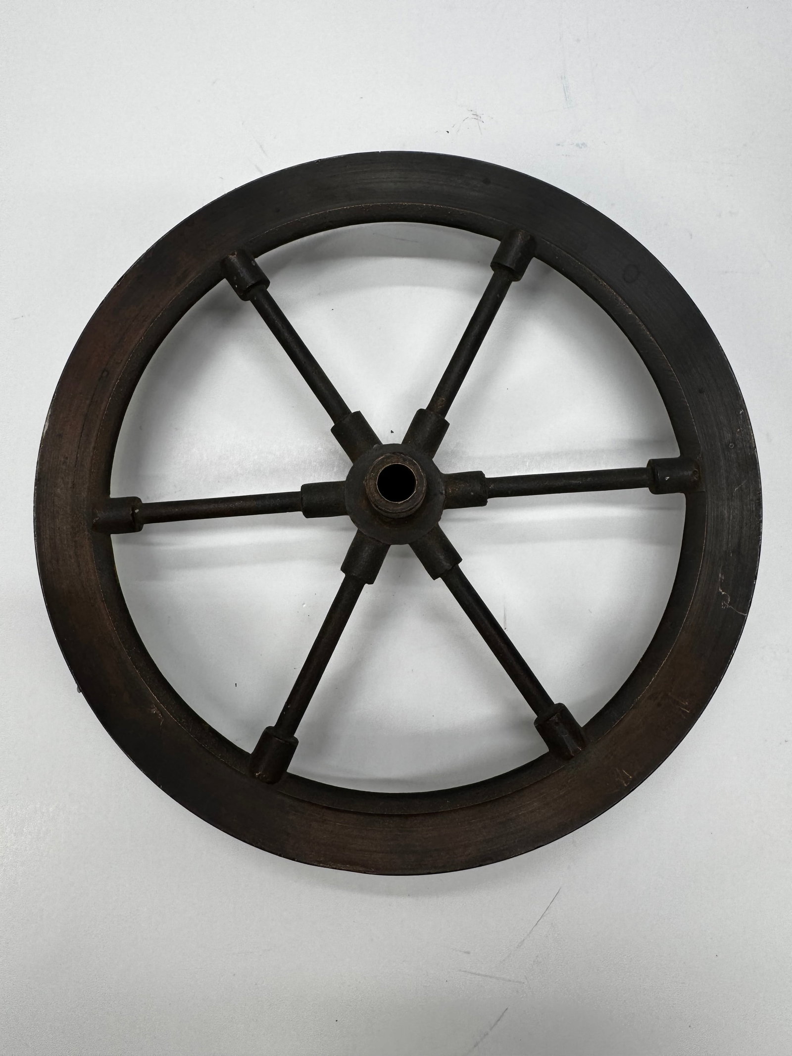 Antique Cast Iron 6-Spoke Flywheel: Original antique cast iron six-spoke flywheel with machined outer rim and keyed center hub. Likely from a small stationary engine, line shaft, or other industrial machinery dating to the late 1800s or