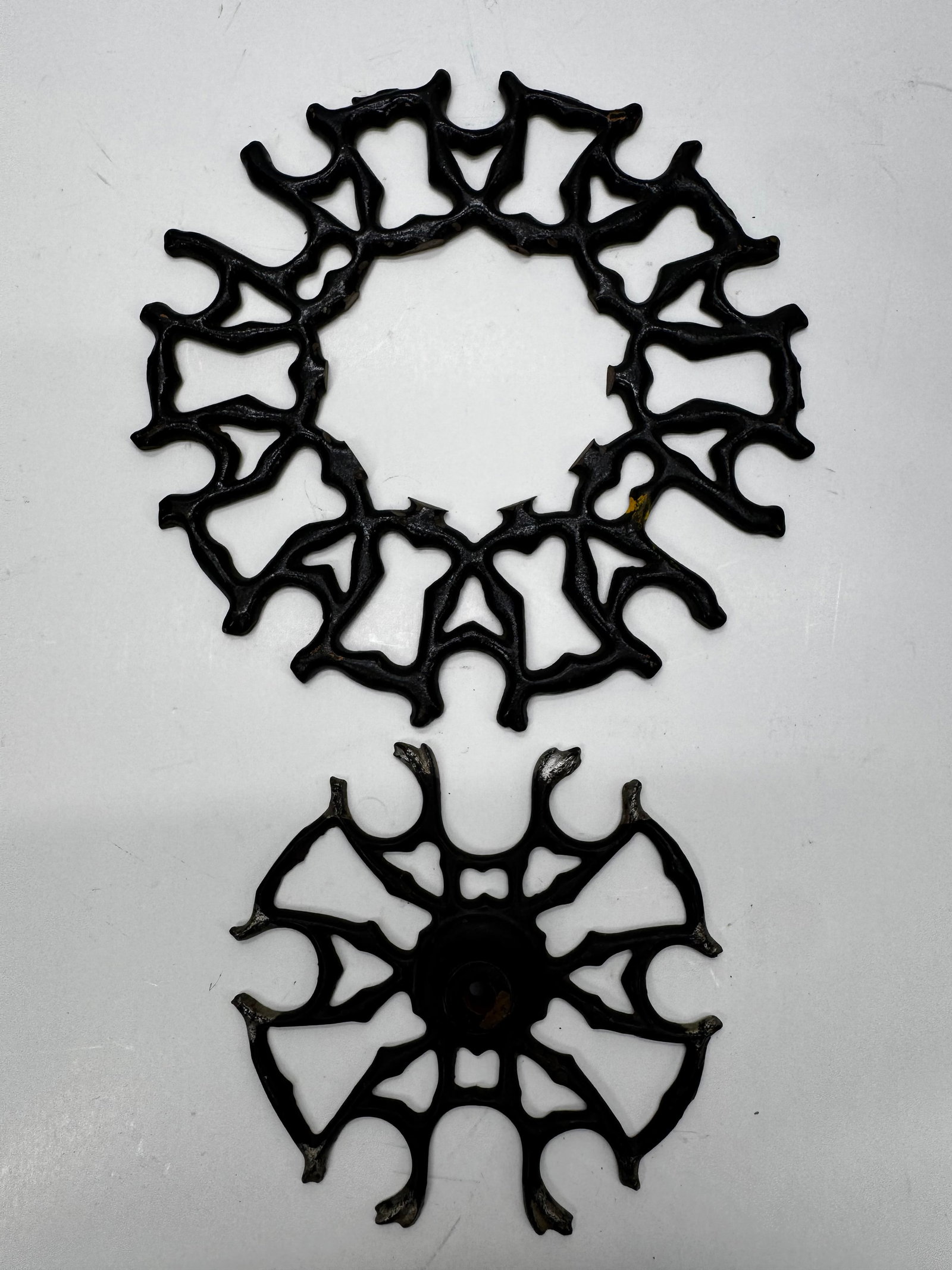 Antique Cast Iron Stove Trivets Lot of 2: Lot of two antique cast iron stove trivets with ornate openwork patterns. These decorative hot plates were commonly used on wood-burning cook stoves or as tabletop trivets to protect surfaces from hot
