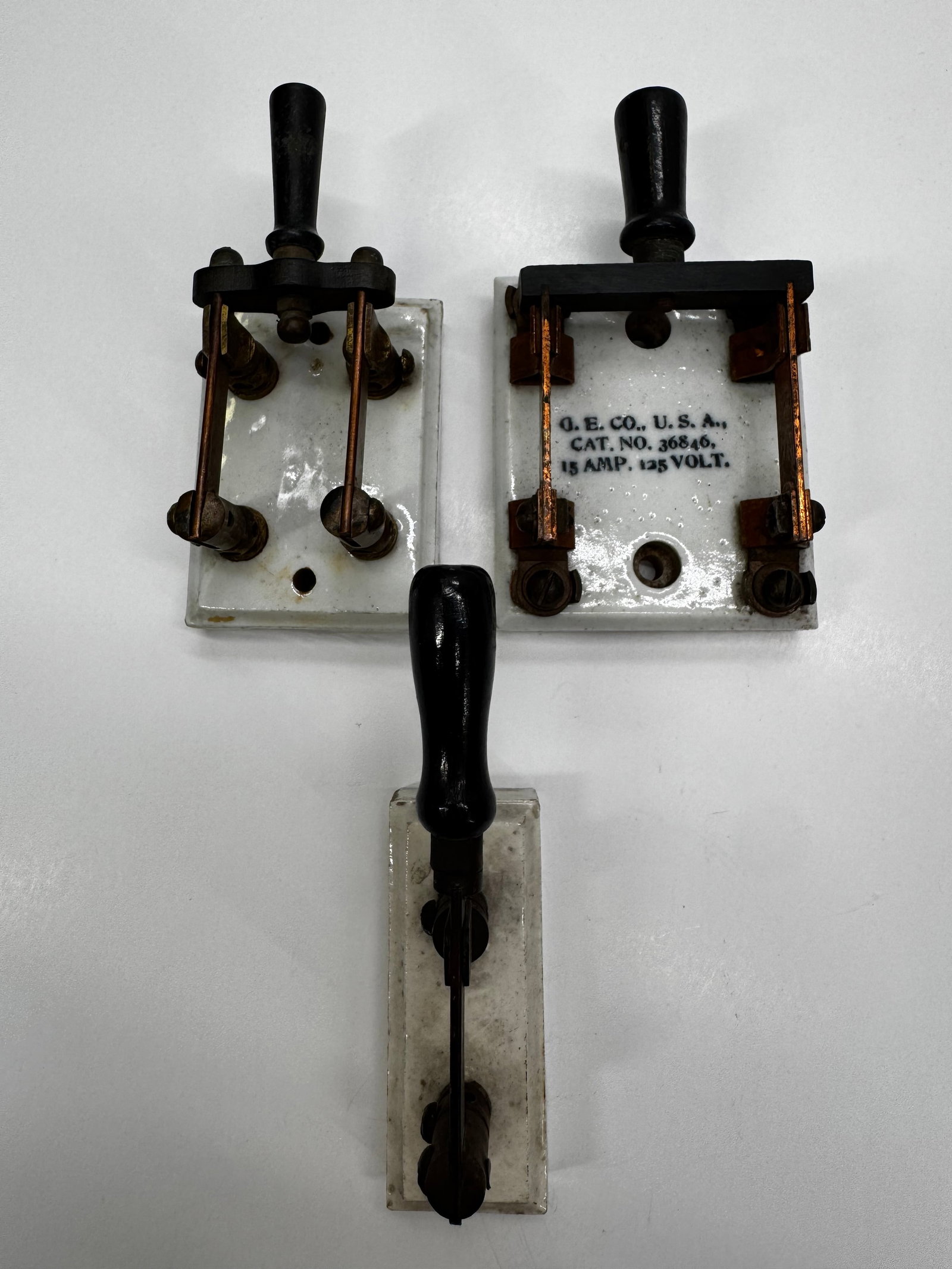 Antique GE Porcelain Knife Switch Lot of 3: Lot of three antique porcelain electrical knife switches manufactured by General Electric Co., U.S.A. One switch is marked Cat. No. 36846, 15 Amp, 125 Volt. These early open-blade switches feature whi