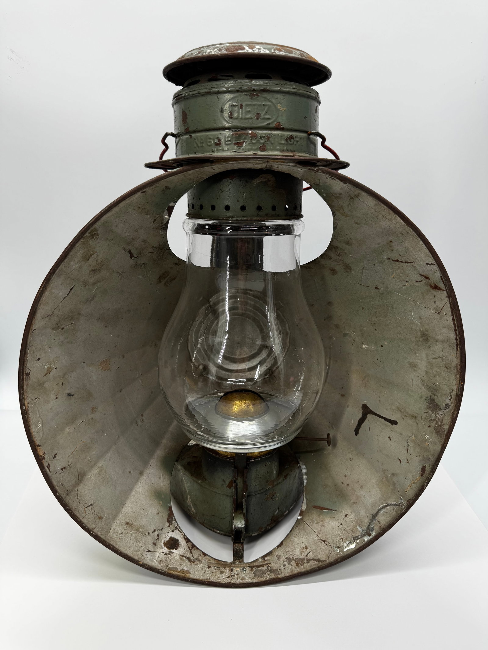 Antique Dietz Railroad Signal Lantern w/ Reflector: Original antique Dietz kerosene railroad signal lantern featuring a large metal reflector, embossed DIETZ burner, and clear glass globe. Finished in its original green paint with heavy age-related wea
