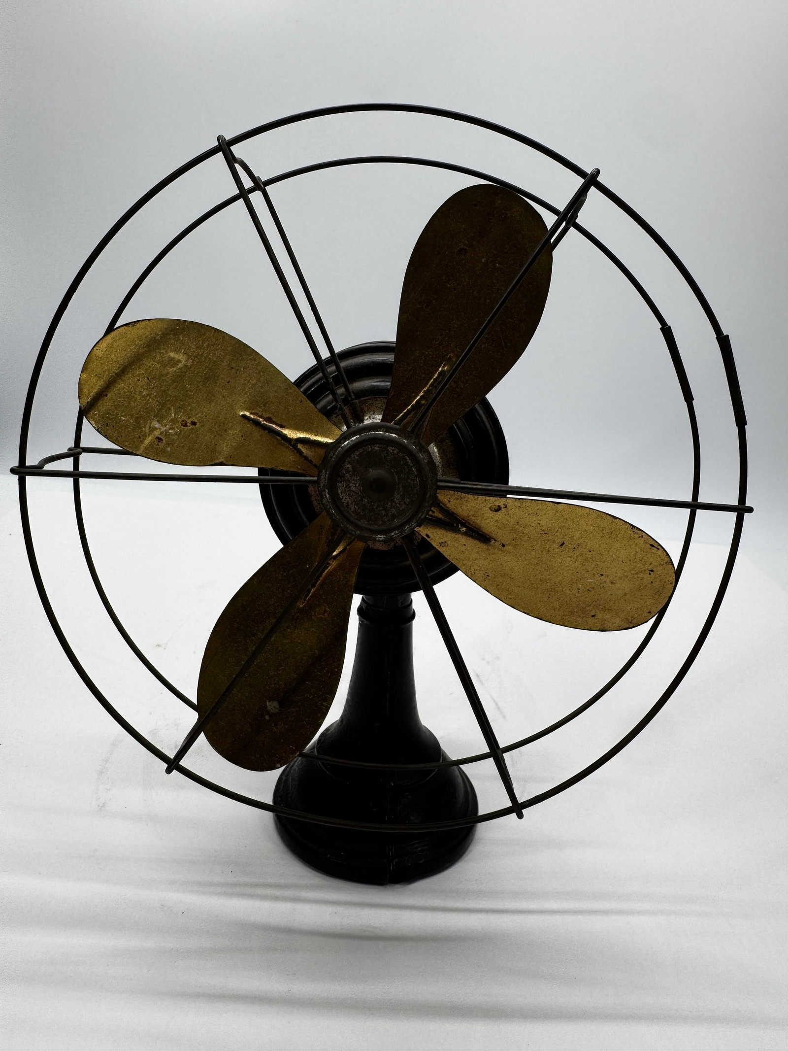 Lawrence M. Stein Co. 815–835 W. Van Buren St. Chicago: This is an antique Lawrence M. Stein electric desk fan, manufactured in the United States during the early 20th century (circa 1910s–1920s). It features a black cast iron motor housing and base, a b