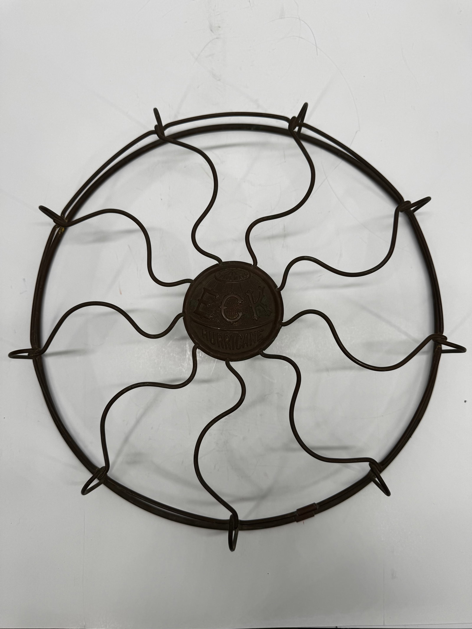Antique Emerson ECK Hurricane Fan Cage Guard Original Brass: Original antique Emerson Electric Co. “ECK Hurricane” fan cage/guard from an early electric desk fan, circa 1905–1915. Features the distinctive brass wire guard with embossed cast center med