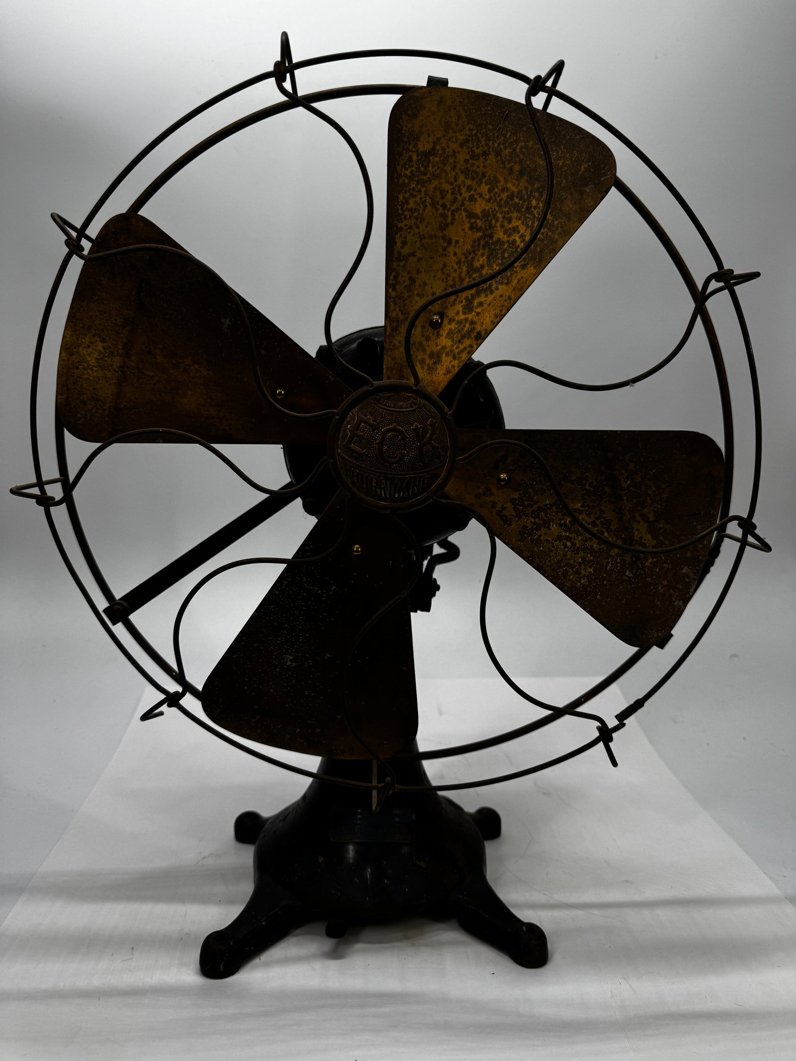 Antique ECK Hurricane Oscillating Electric Fan 16” Brass Blade Cast Iron Base: Antique ECK Hurricane oscillating electric fan manufactured by the ECK Dynamo & Motor Co., Belleville, New Jersey. Features a heavy cast iron base, four brass blades, original ECK Hurricane center bad