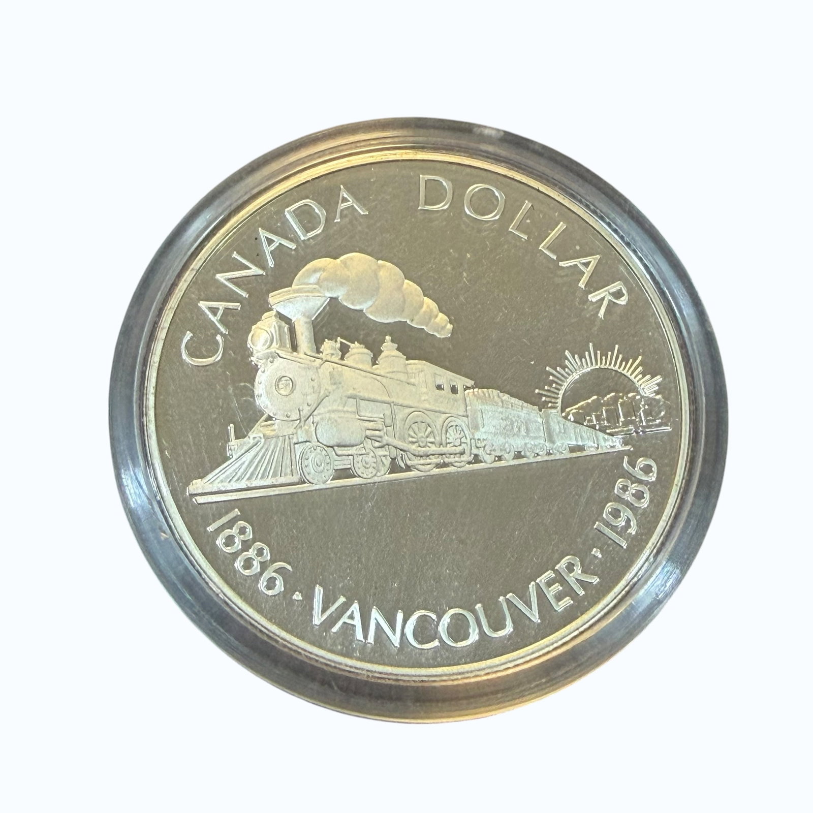 1886 Vancouver Transcontinental 1986 Canada Dollar Silver Coin & Case Uncirculated 23.33g: Description: Uncirculated coin, Elizabeth II D.G. Regina, Canada Dollar Transcontinental Railway Vancouver 1886 1986. Sealed in holder and with original display case. / Material: .5000 Silver. 36.07 m