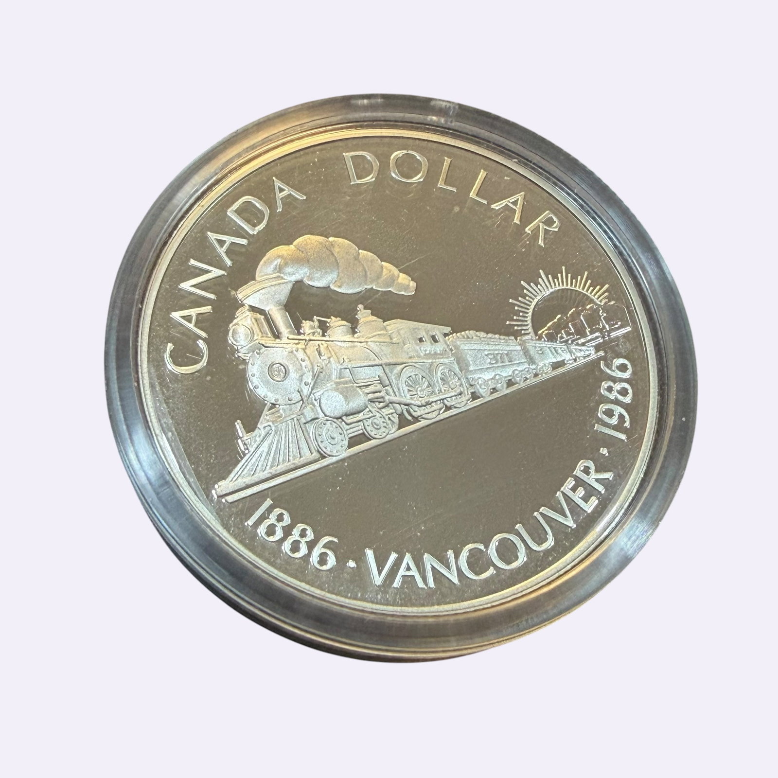 Transcontinental Vancouver Railway 1986 Canada Dollar Silver Coin & Case Uncirculated 23.33g: Description: Uncirculated coin, Elizabeth II D.G. Regina, Canada Dollar Vancouver Transcontinental Railroad 1886 1986. Sealed in holder and with original display case. / Material: .5000 Silver. 36.07 