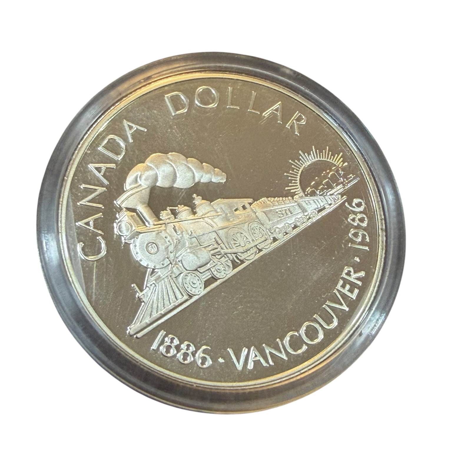 Vancouver 1986 Canada Dollar Silver Coin Transcontinental Railway & Case Uncirculated 23.33g: Description: Uncirculated coin, Elizabeth II D.G. Regina, Canada Dollar 1886 1986 Vancouver 100th Transcontinental. Sealed in holder and with original display case. / Material: .5000 Silver. 36.07 mm 