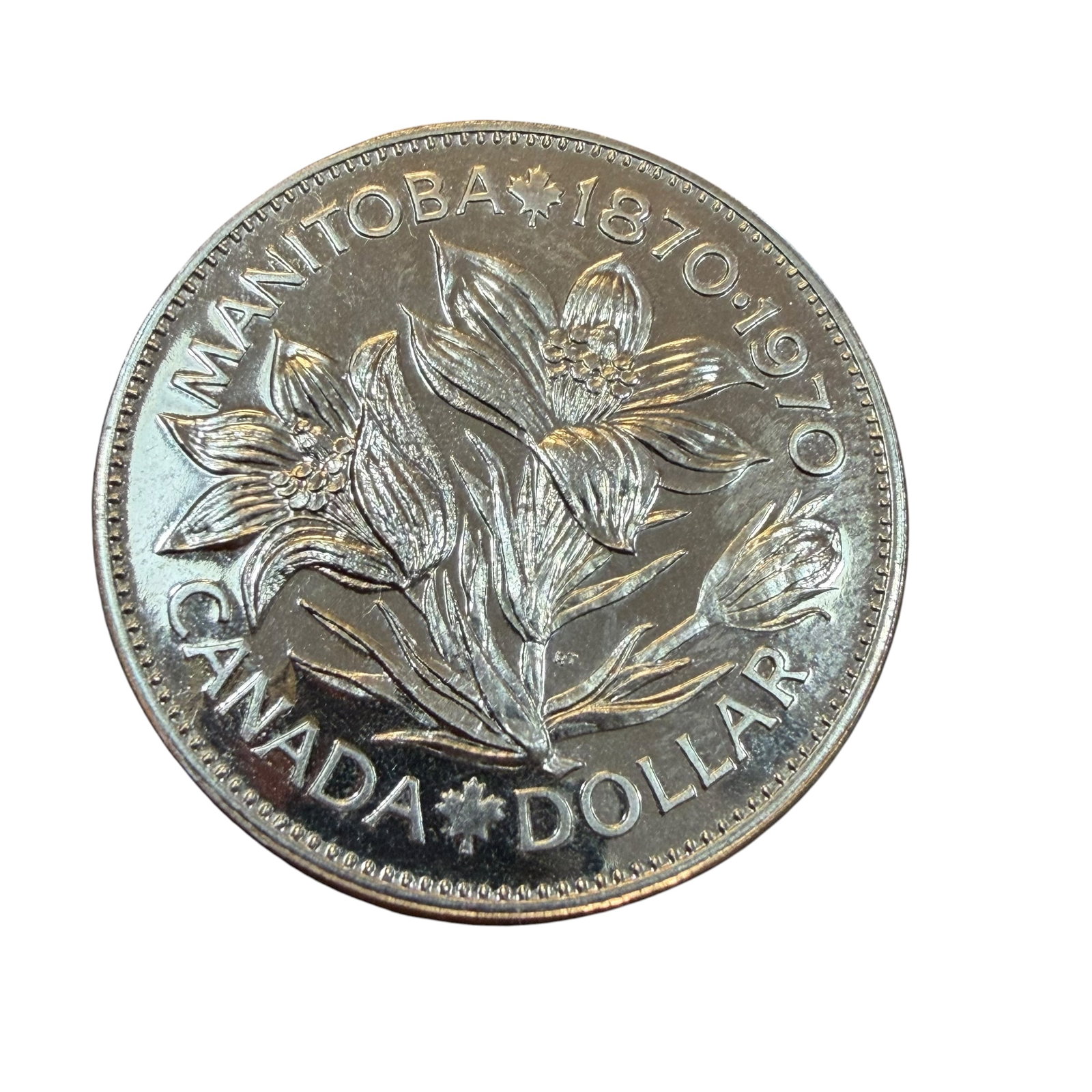 Manitoba 1870 1970 Canada Dollar Silver Coin Loose Uncirculated 23.33g: Description: Uncirculated coin, Elizabeth II D.G. Regina, Canada Dollar 1870 1970 Manitoba. This is a loose coin with the black plastic frame. / Material: .5000 Silver. 36.07 mm dia. 23.33 grams. / Co