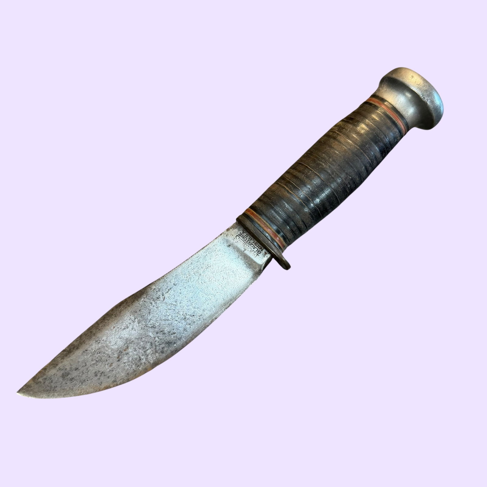 1916 Marble’s Fixed Blade Hunting Knife 4 3/8”: Description: Patented 1916 Marble’s fixed blade hunting knife. Steel blade. Brass guard. Aluminum pommel. Stacked leather handle. / Size: Blade 4 3/8”. 8 1/4” long overall. / Condition: 