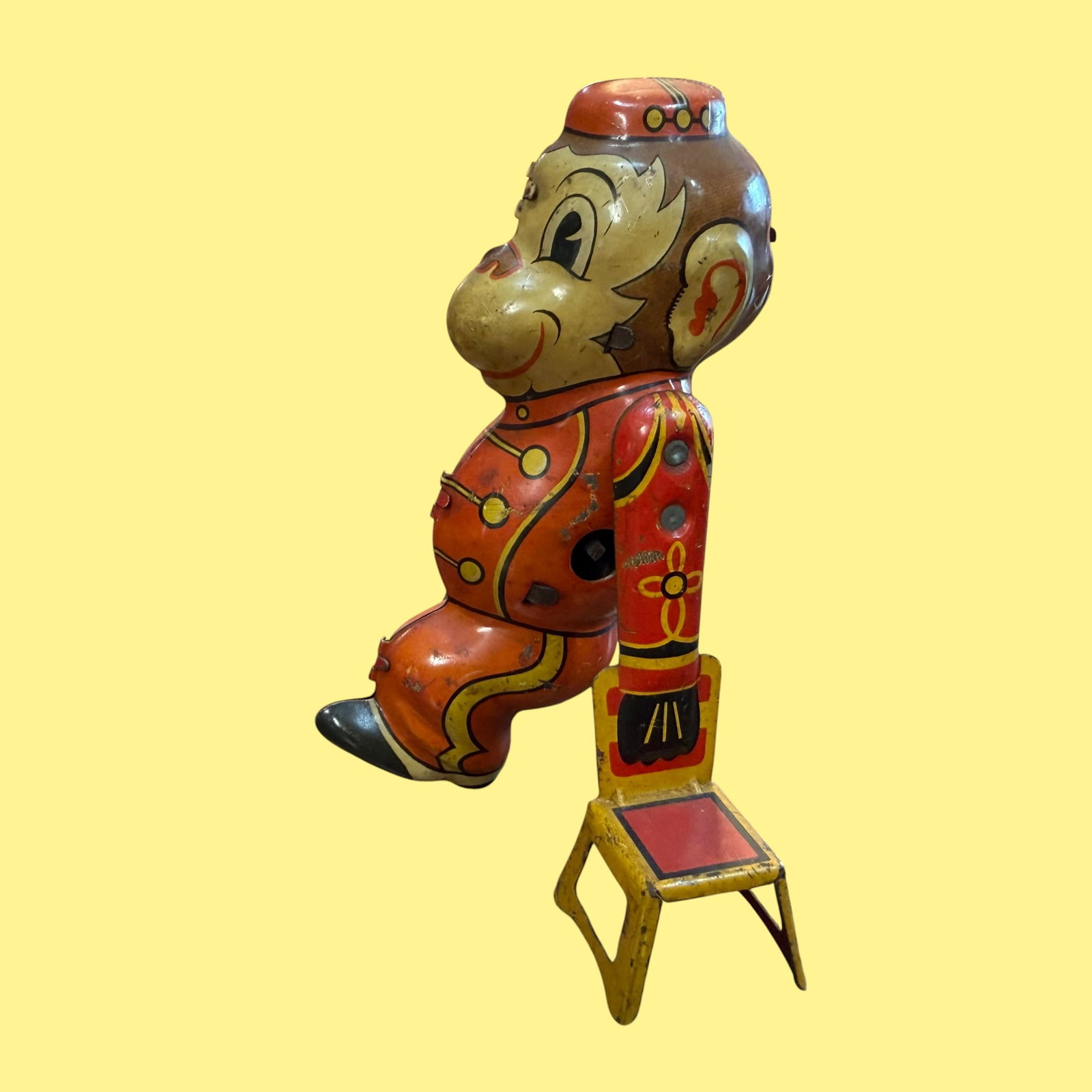 Vintage Marx Wind Up Tin Litho Acrobat Monkey Toy: Description: Lithographed tin wind up toy of Acrobat Monkey. It looks as though he swings back and forth while holding onto the chairs on either side. No key included. / Size: 5” tall. / Conditi