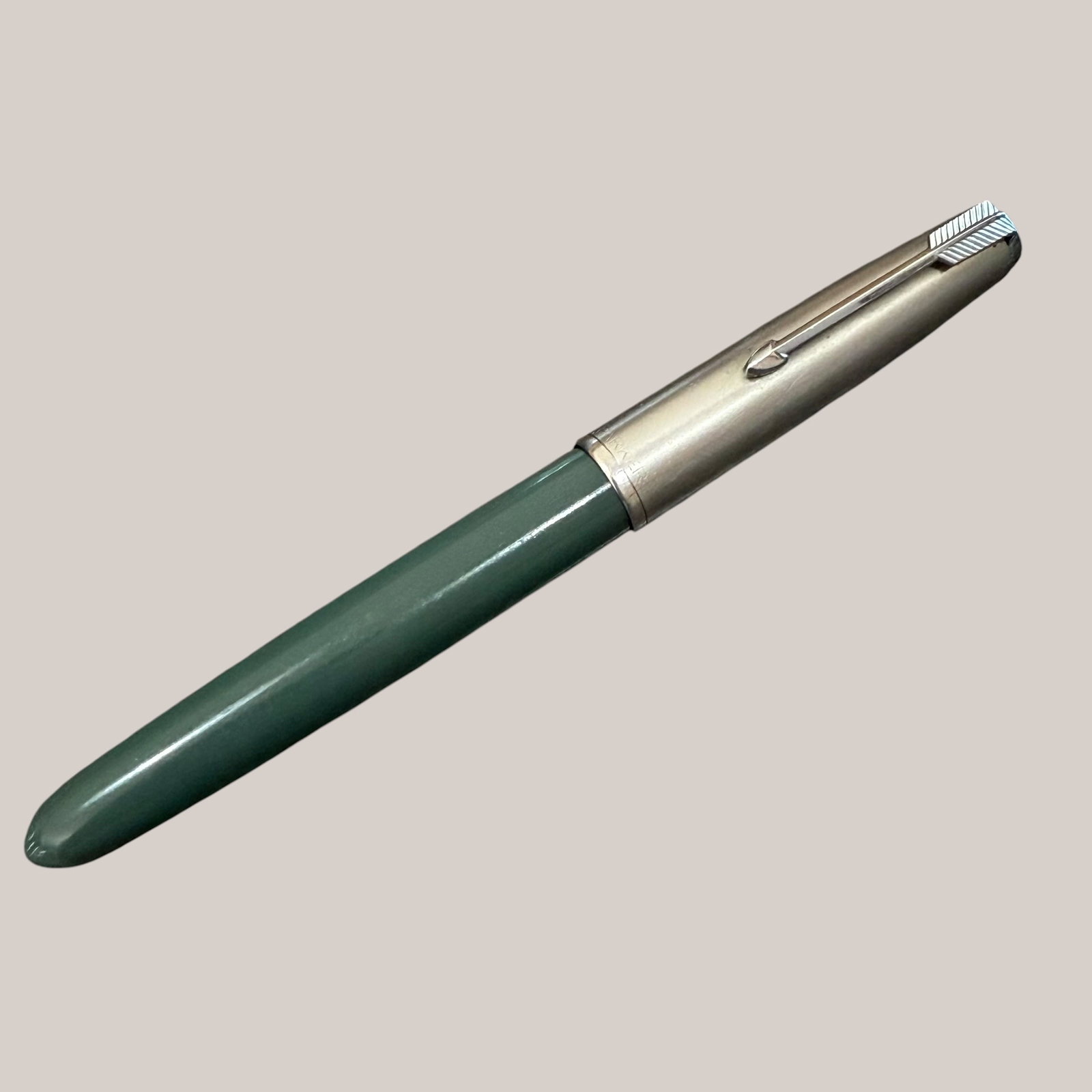 1950s Parker 51 Aerometric Fountain Pen Navy Gray Steel Cap Personalized: Description: Circa 1950s Parker 51 fountain pen. Aerometric squeeze filling system. Bladder is present. Color Navy Grey. Stainless steel cap. Personalized with the name Elyse Bull on the body. / Size: