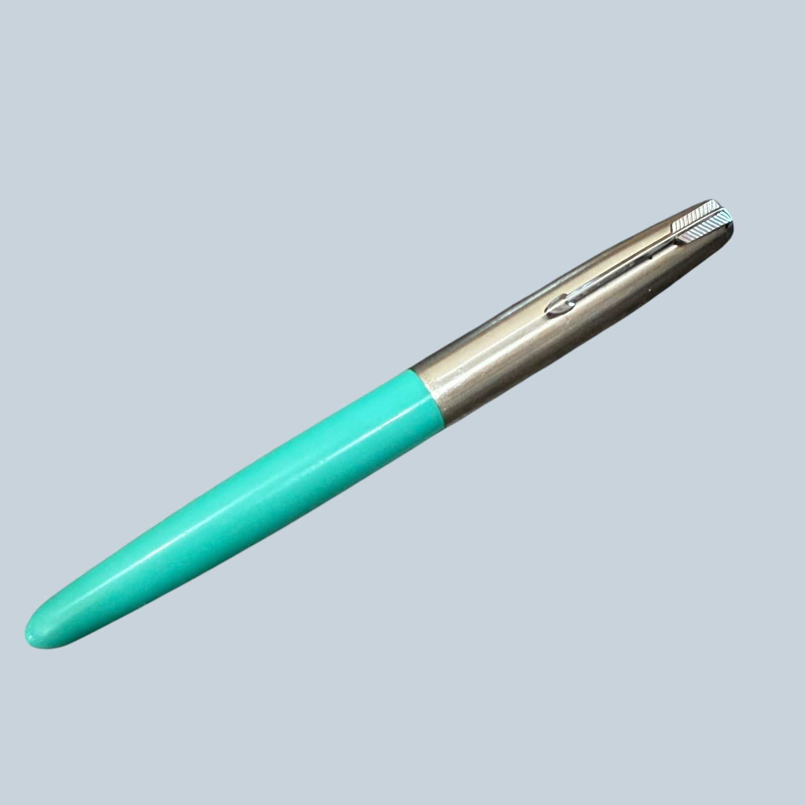 1950s Parker 41 Aerometric Fountain Pen Turquoise: Description: Vintage circa 1950s Parker 41 fountain pen. Aerometric fill system. Turquoise color. Stainless steel cap. All parts present. / Size: 5 5/16” long with cap. / Condition: Great, ready