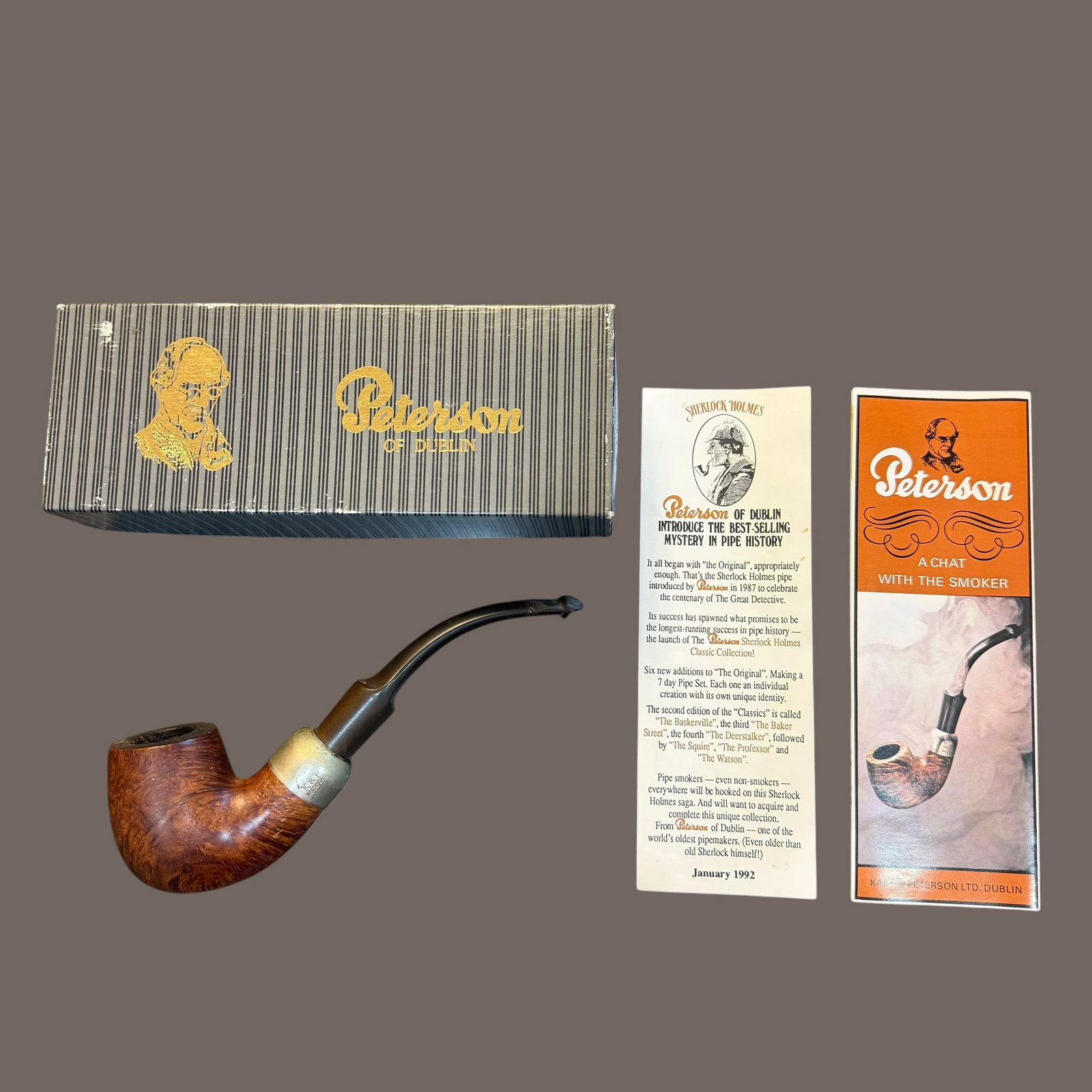 K&P Peterson Smoking Pipe 307 Burl Wood w/ Box and Papers: Description: Vintage smoking pipe marked K&P Peterson, 307 7. Made in Dublin Ireland. Comes with a box though I don’t know if it’s correct to the pipe. Includes papers as well. / Material: Burl wo