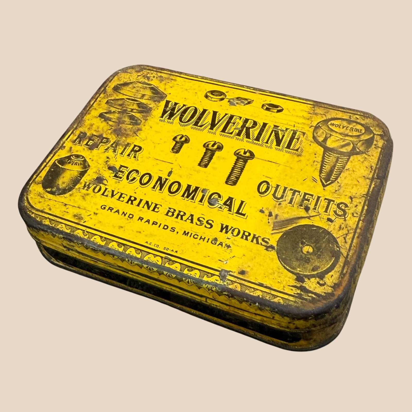 Early 1900s Wolverine Economical Repair Outfit Tin Brass Screw Assortment Full: Description: Full tin of brass screws from Wolverine Brass Works, Grand Rapids, Michigan. / Material: Metal tin, brass screws. / Size: Overall 3.875” x 2.875” x .875”. / Condition: R