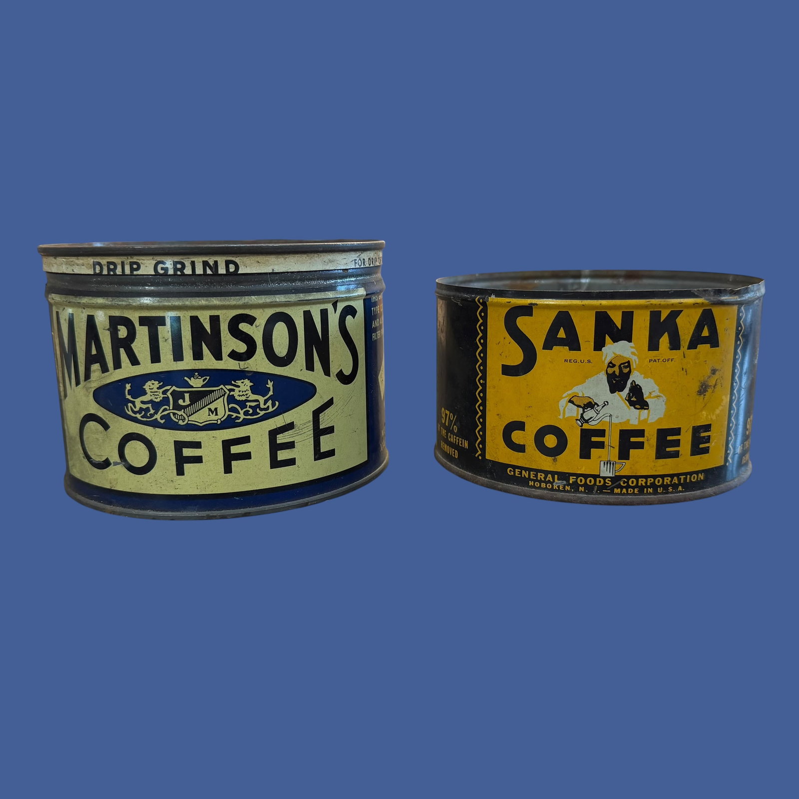 2 Early 1900s Coffee Can Tins General Foods Sanka Martinson’s: Description: Pair of early coffee tin cans. General Foods Sanka, Hoboken, NJ. Martinson’s Coffee, New York NY. Sanka does not have lid. / Material: Tin. / Size: Each 5” diameter. Sanka 2.875&r
