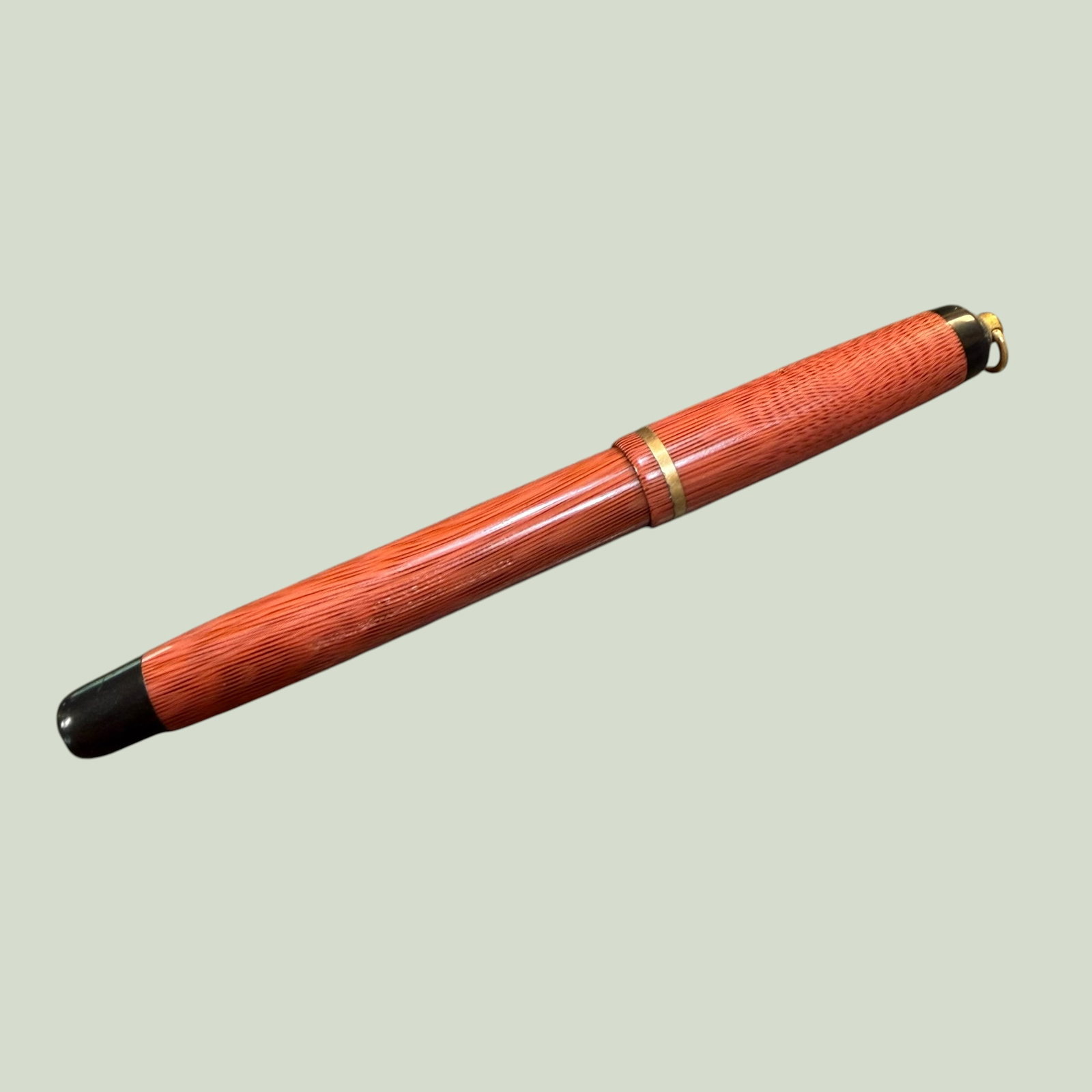 Geo. S. Parker Ring Top Pastel Fountain Pen Gold Nib Moire Coral: Description: Vintage Fountain Pen by Parker, the Pastel Moire Ring Top in a Coral color pattern. Appears to have a Gold nib though it is not marked as such. / Size: Overall closed including ring 5.125