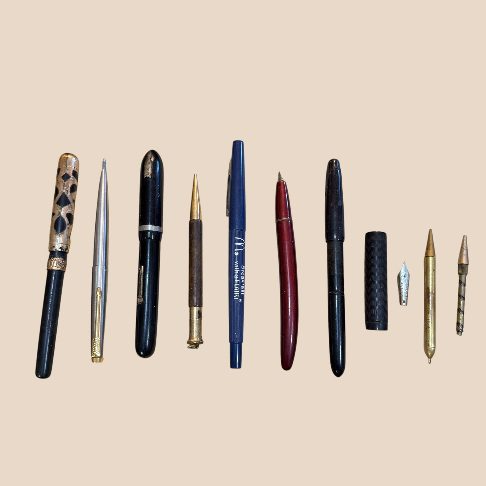 8 Different Fountain Pen Mechanical Pencil Collection & Parts: Description: Seven different fountain pens and mechanical pencils plus one felt pen and miscellaneous parts.. Varying conditions. Untested. One has a gold plated filigree cutaway cap cover, but no nib