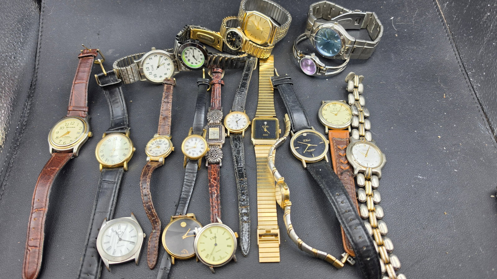 Large Mixed Watch Lot 20+ Pieces Lorus Chax Diamond Gitano Jordache Charles Delon Edison Parts Resal: This is a mixed lot of approximately 20 or more watches in a wide variety of styles spanning the 1980s through 2000s, offered as a single collection for resale, parts, or display. Identifiable pieces 