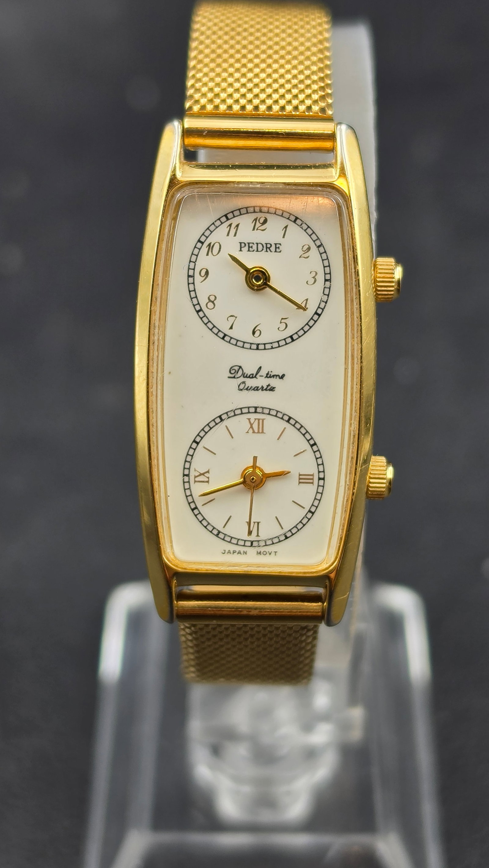Pedre Dual-Time Quartz Ladies Watch Gold Tone Mesh Bracelet Two Sub-Dial Japan Movt New Batteries: This is a Pedre Dual-time Quartz ladies watch with two independent Japanese quartz movements housed in a single gold-tone barrel-shaped case measuring 19mm wide. The white dial presents two stacked su