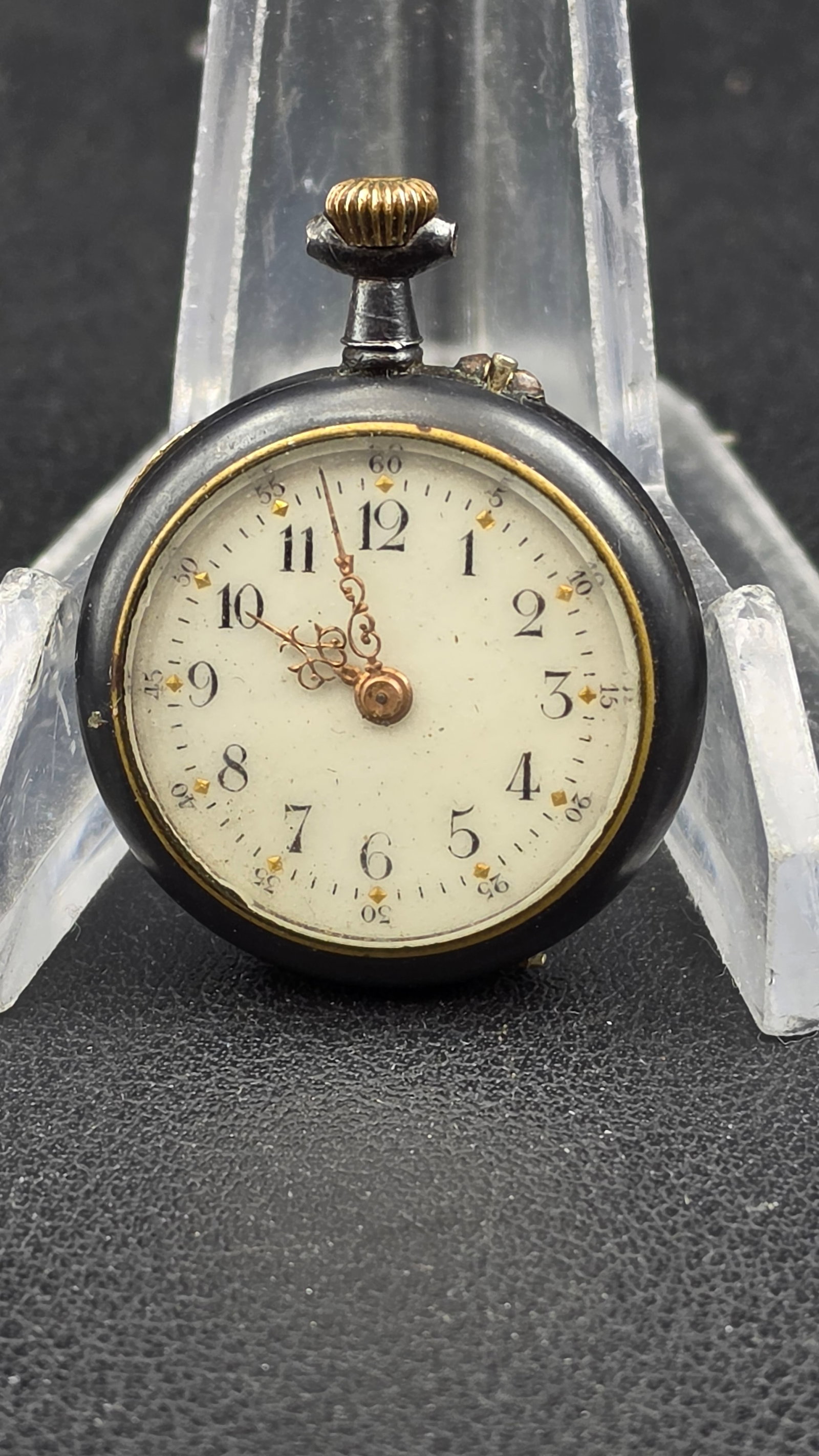 Antique Swiss Miniature Ladies Fob Watch Black Case Gold Jeweled Movement, Running: A charming antique Swiss miniature fob watch measuring just 28mm across, housed in a smooth black case — most likely vulcanite or ebonite — with a gold inner bezel ring framing the dial. The white