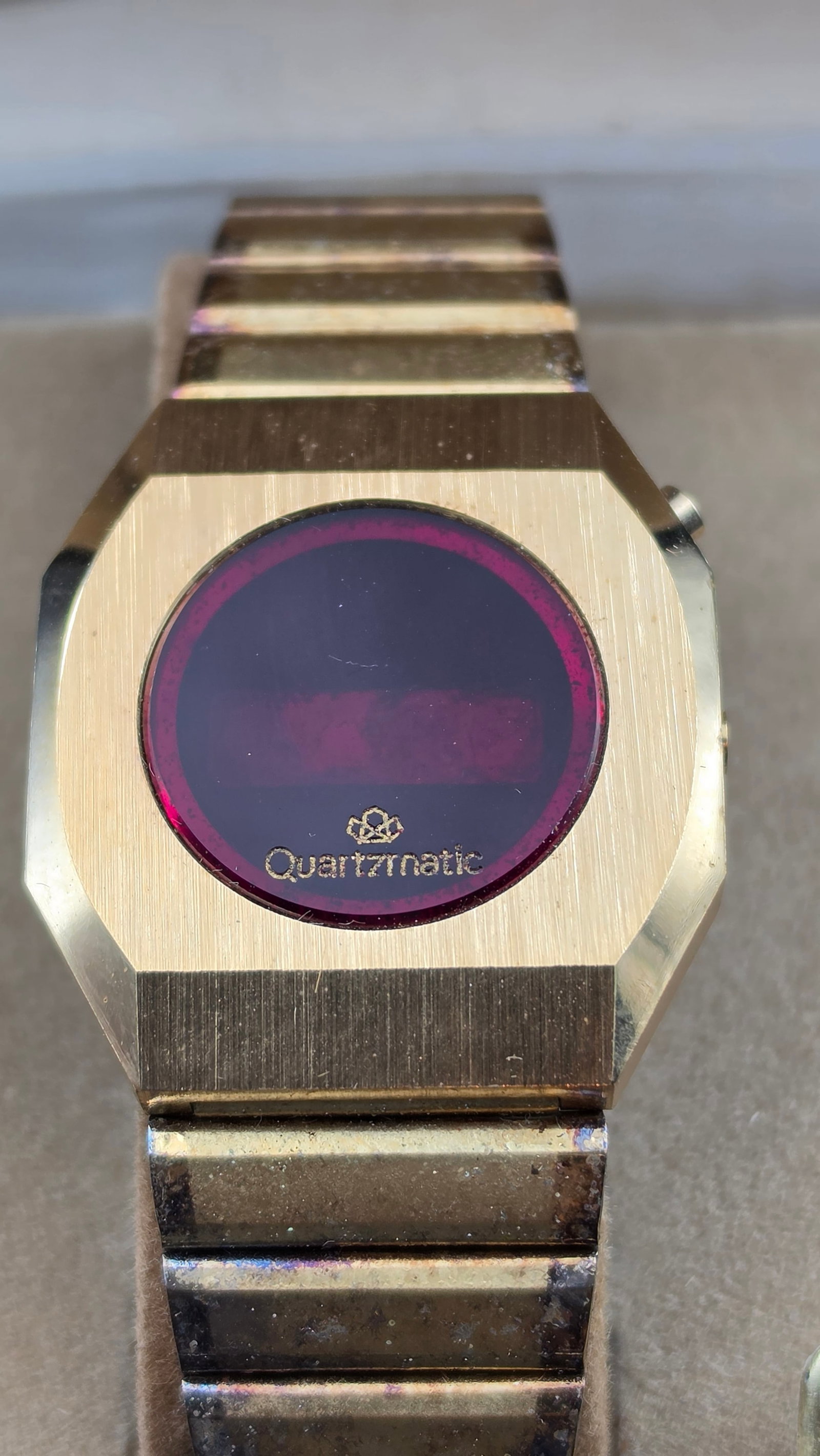 Quartzmatic by Westclox "Aztec" Men's Gold-Tone LED Digital Watch NOS Complete w/ Box: This is a New Old Stock Quartzmatic by Westclox "Aztec" style men's digital wristwatch, gold-color octagonal case with round dark red crystal window marked "Quartzmatic," fitted with a matching gold-c