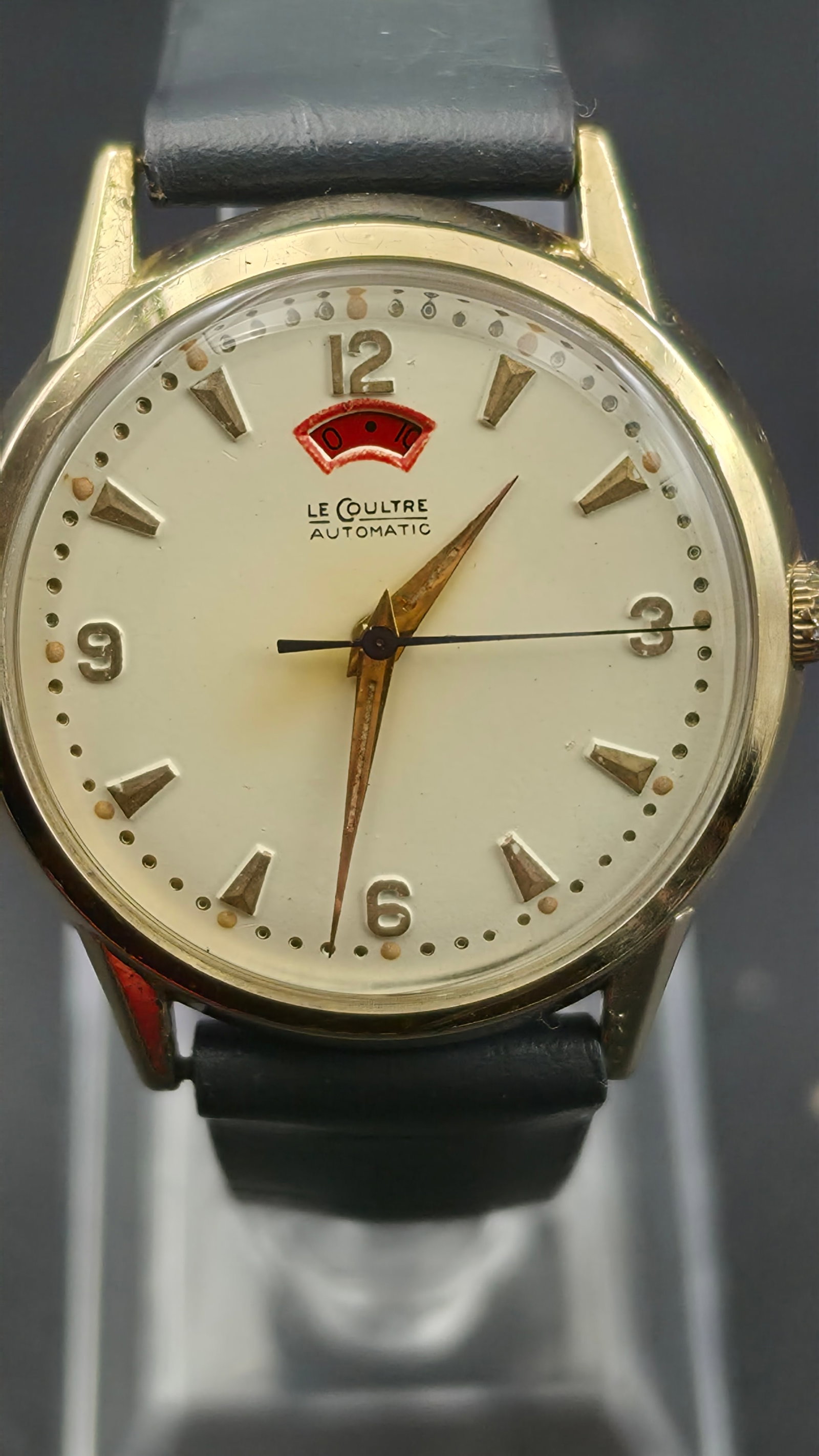 LeCoultre Automatic Power Reserve Watch 10K Gold Filled Caliber 481 Circa 1957: Vintage LeCoultre automatic dress watch with power reserve indication. Dial signed LeCoultre Automatic, with the red power-reserve arc window near 12. Movement signed Le Coultre Co, Seventeen 17 Jewel