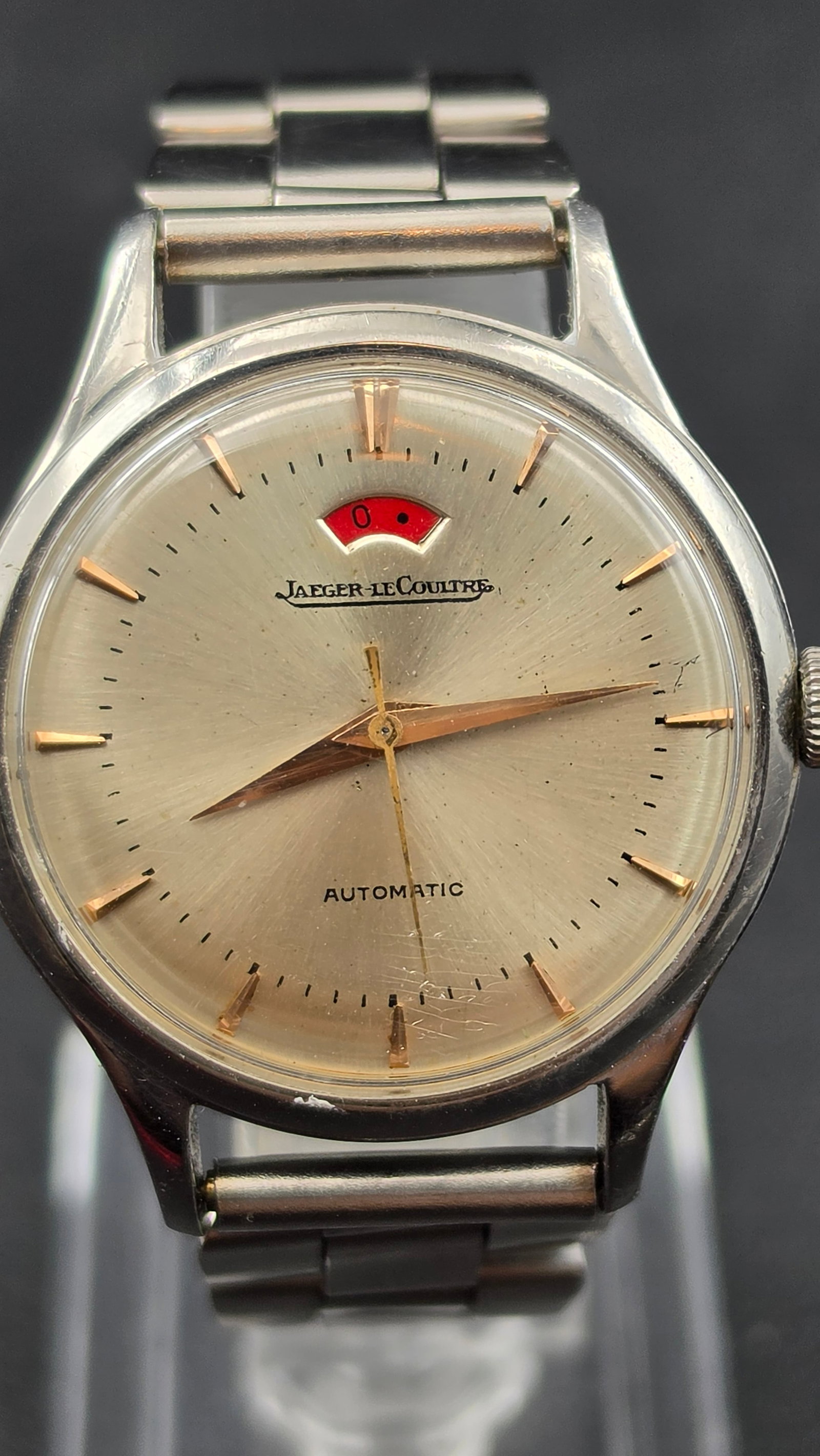 Jaeger-LeCoultre Powermatic Bumper Automatic Caliber 481 Red Power Reserve Stainless Steel 1950s: This is the Jaeger-LeCoultre caliber 481 "Powermatic" — the first automatic wristwatch movement ever fitted with a power reserve indicator, introduced in 1948. This example is a bumper automatic (ro