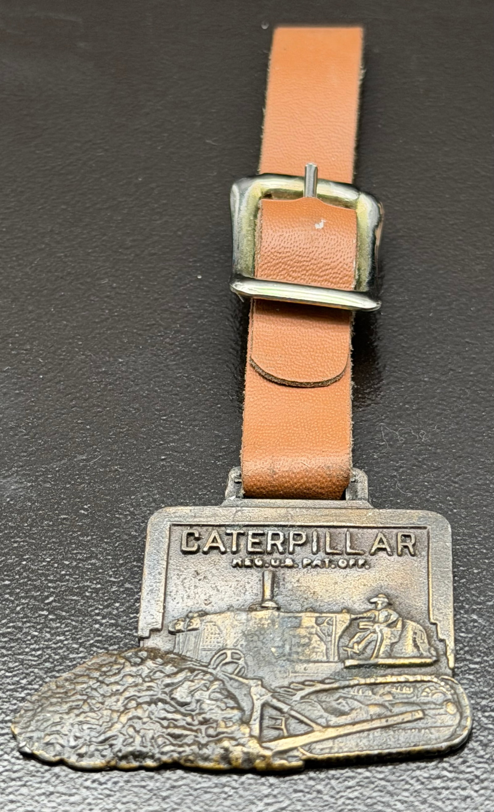 27g-Vintage Caterpillar Tractor Advertising Watch Fob / Key Fob – Beckwith Machinery Co. –: Original vintage Caterpillar advertising watch fob featuring a detailed raised image of an early Caterpillar crawler tractor with “CATERPILLAR – REG. U.S. PAT. OFF.” on the front. The revers