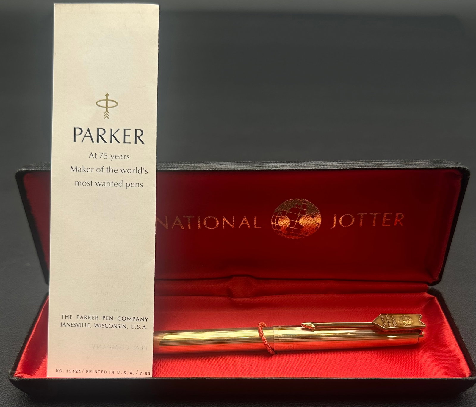 Vintage Parker 61 12K Gold Filled Ballpoint Pen w/ Box & Papers: Vintage Parker 61 ballpoint pen with a 12K Gold Filled rolled gold cap and barrel, marked 1/20 12K GF. Includes the original Parker presentation box and 1963 Parker brochure. Pen shows light handling 