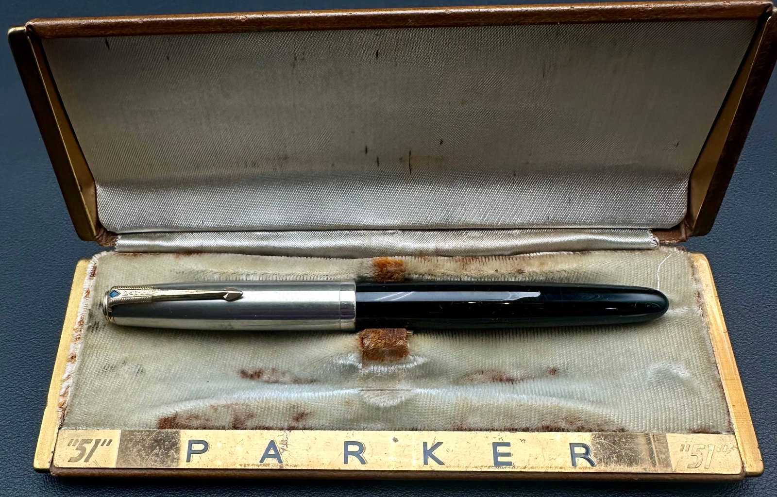 Vintage Parker “51” Fountain Pen w/ Lustraloy Cap & Original Box: Vintage Parker “51” fountain pen featuring a black Lucite barrel with a brushed Lustraloy stainless steel cap and the classic blue diamond clip. Includes the original Parker “51” prese