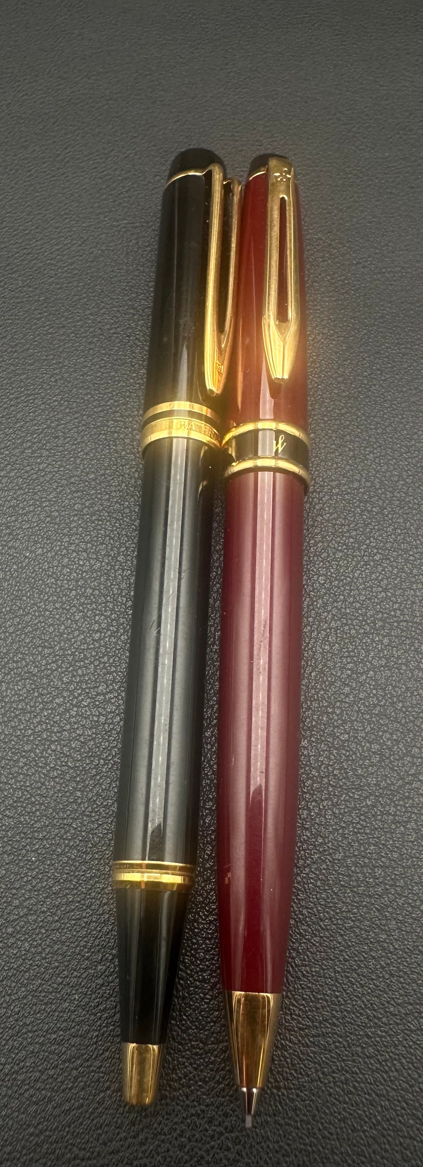 Vintage Waterman Paris Fountain Pen & Pencil Set France: Vintage Waterman Paris two-piece writing set made in France, including a black lacquer fountain pen with gold-tone trim and a burgundy mechanical pencil. Both feature the classic Waterman clip design 