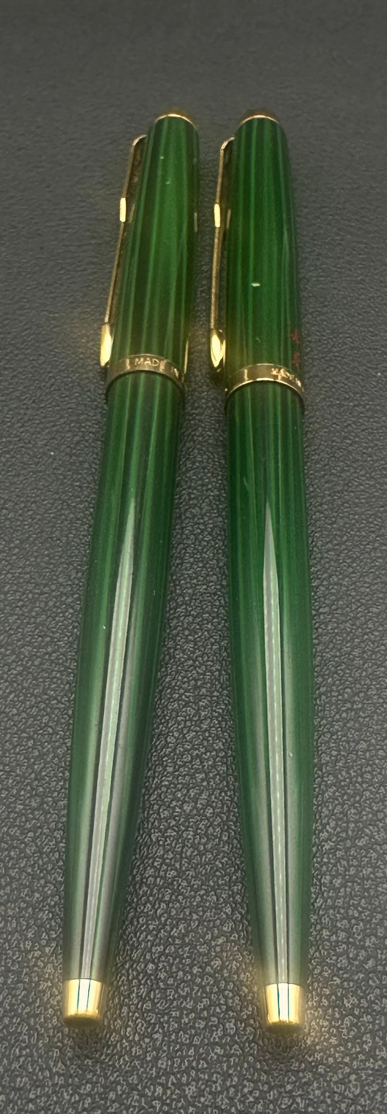Waterman France Green Lacquer Fountain Pen & Ballpoint Set: Vintage Waterman writing set including a matching green lacquer fountain pen and ballpoint with gold-plated trim. Both are marked Made in France. One pen features red Asian character decoration/person