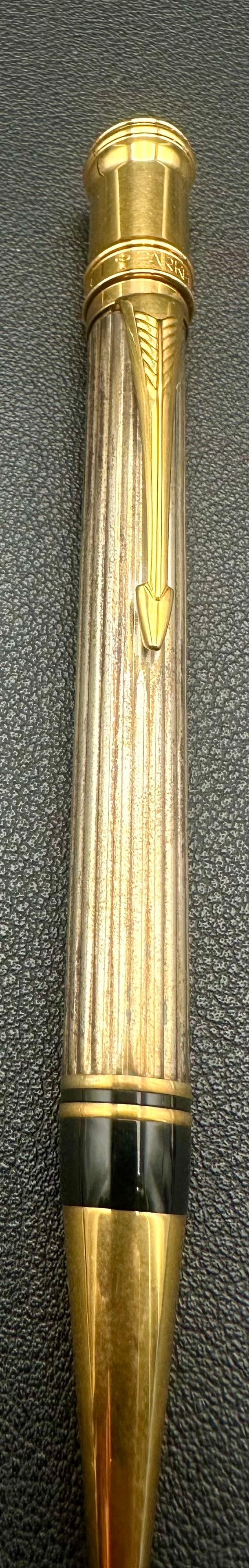 Parker Duofold Sterling Silver Pinstripe Ballpoint Pen Gold Trim: Vintage Parker Duofold twist ballpoint pen featuring a sterling silver pinstripe (Godron) barrel with gold-plated trim and the iconic Parker arrow clip. The cap is finished with the Parker Duofold ros