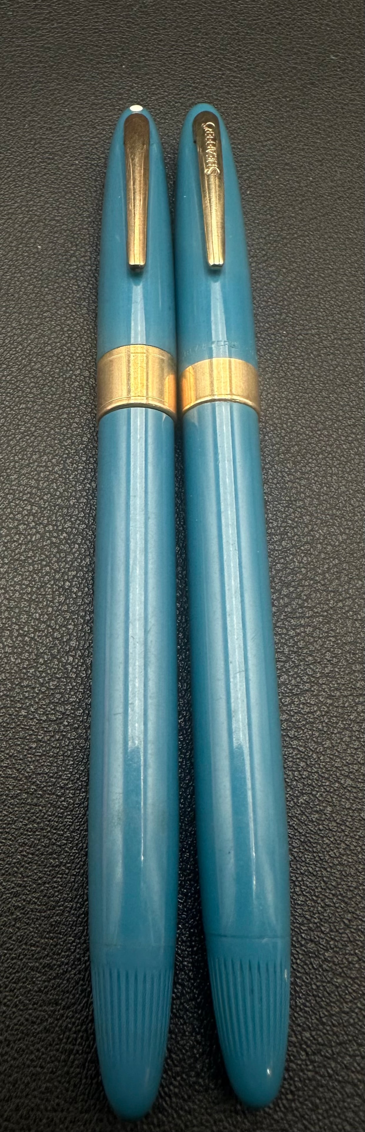 Vintage Sheaffer Blue Fountain Pen & Pencil Set 14K Nib USA: Vintage Sheaffer matching writing set including one fountain pen with a 14K gold nib and one mechanical pencil in blue plastic with gold-filled cap bands. Barrel imprint reads W.A. Sheaffer Pen Co., F
