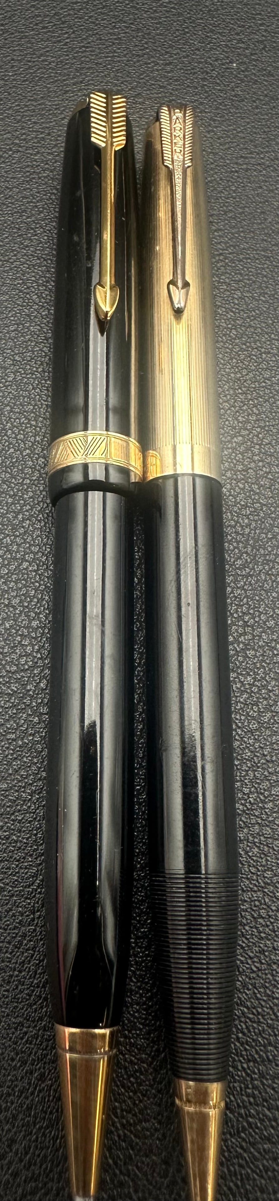 Vintage Parker 51 Ballpoint & Sheaffer 12K Gold Filled Pencil Lot: Lot of two vintage American writing instruments. Includes a black Parker 51 ballpoint pen with gold-filled cap band and gold-tone trim, marked Parker Made in U.S.A. Also included is a black Sheaffer m