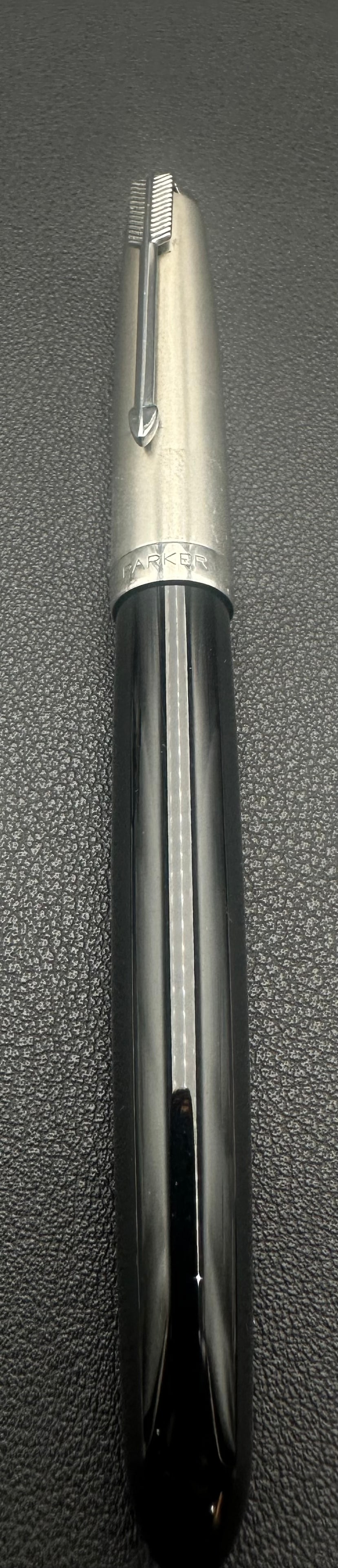 Vintage Parker 51 Aerometric Fountain Pen Lustraloy Cap USA: Vintage Parker 51 Aerometric fountain pen, made in the USA circa 1950s–1960s. Features a black Lucite barrel, brushed Lustraloy stainless steel cap with Parker arrow clip, and original hooded nib. O