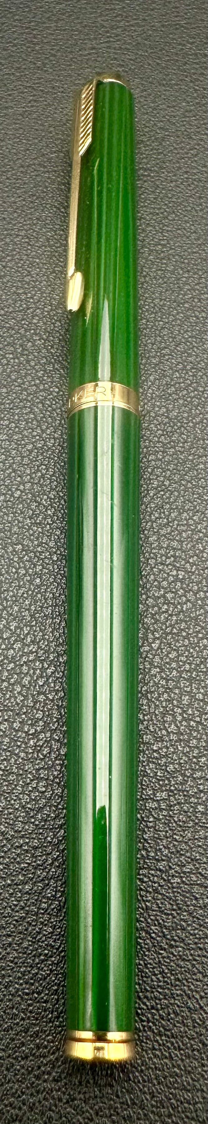Parker Sonnet Green Lacquer Gold Trim Ballpoint Pen Made in France: Vintage Parker Sonnet twist ballpoint pen featuring a glossy green lacquer barrel and cap with gold-plated trim and the classic Parker arrow clip. Marked “Made in France.” The barrel has red C