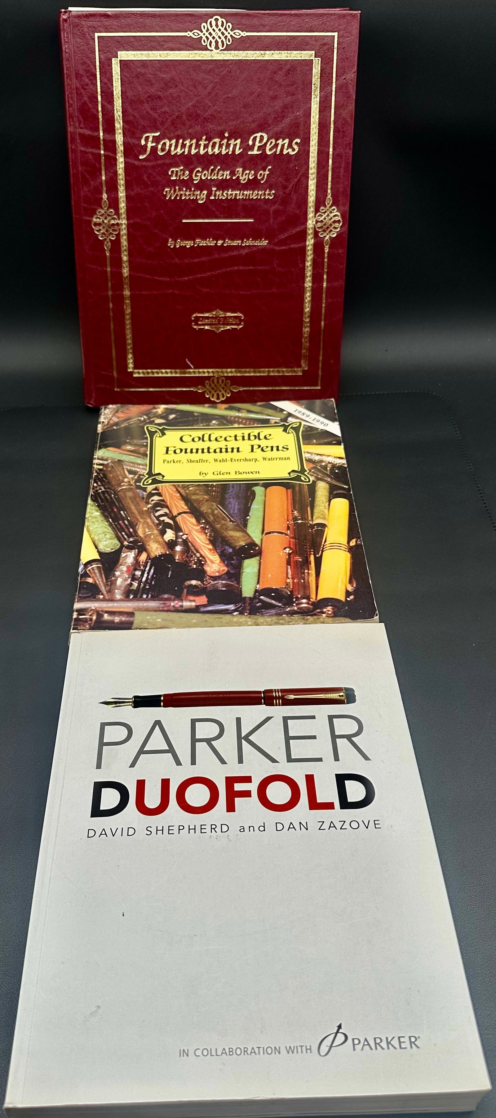 3 Fountain Pen Reference Books Parker Duofold Collectible Pens Book Lot: Lot of three fountain pen reference books for collectors and enthusiasts. Includes Parker Duofold by David Shepherd & Dan Zazove, Collectible Fountain Pens by Glen Bowen, and Fountain Pens: The Golden
