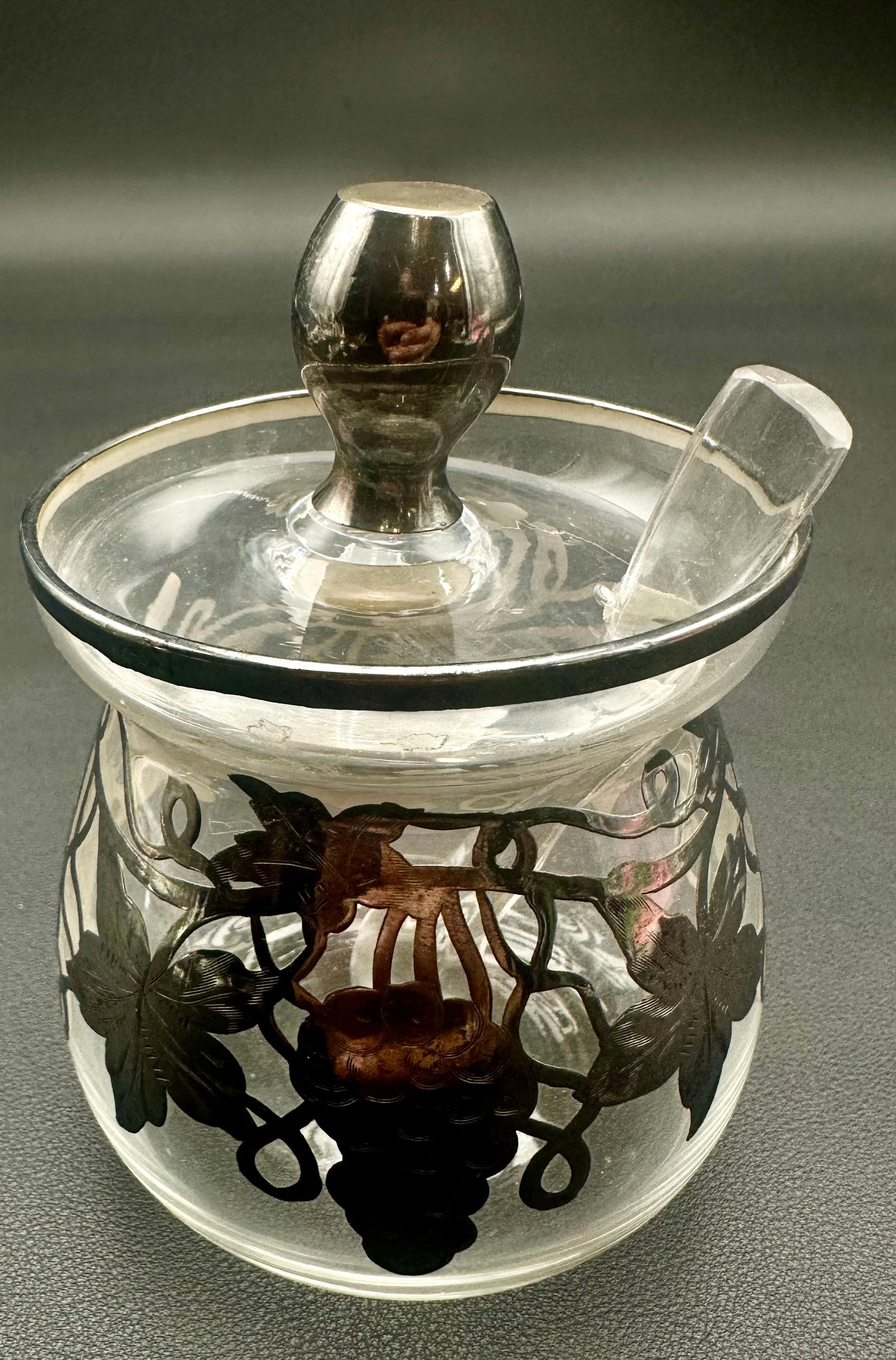Antique Weidlich Sterling Silver Overlay Glass Honey Sugar Jar w/ Lid & Spoon: Antique Weidlich sterling silver overlay clear glass honey or sugar jar featuring an elegant grapevine and leaf motif. Includes the original fitted glass lid with knob and matching glass spoon. The si
