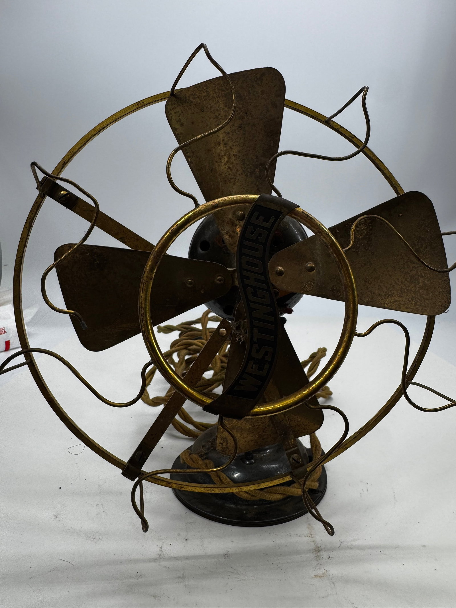 Antique Westinghouse Brass Blade Tank Desk Fan Cast Iron c.1906–1915: Antique Westinghouse “tank” style electric desk fan dating to the early 1900s, circa 1906–1915. Features original brass blades, matching brass wire cage, and a heavy cast iron motor housing 