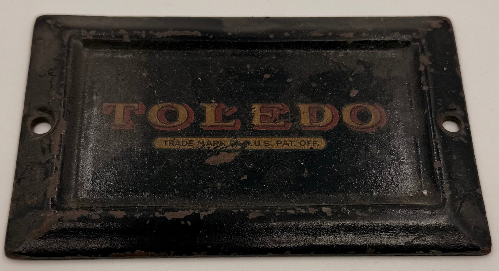 Antique Toledo Cast Iron Nameplate: This antique cast iron Toledo nameplate is an original industrial badge from the Toledo Scale Company, commonly found on vintage scales and other industrial equipment. The front features the classic