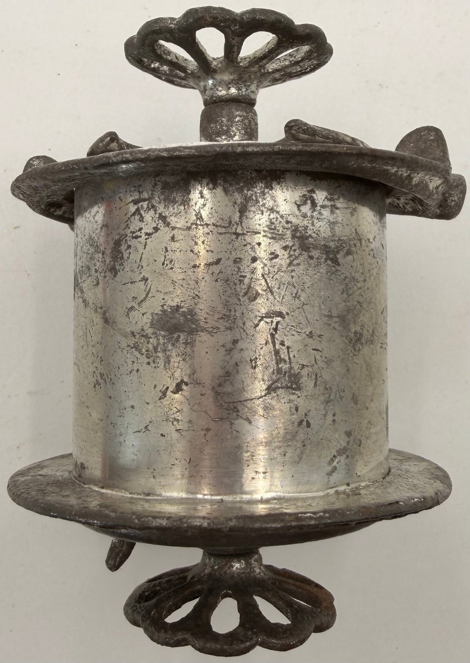 Antique Cast Iron Spirit Burner Stove: This antique cast iron spirit burner or portable heating stove features a decorative cast iron frame with a cylindrical metal fuel reservoir. The ornate design includes a vented burner assembly,