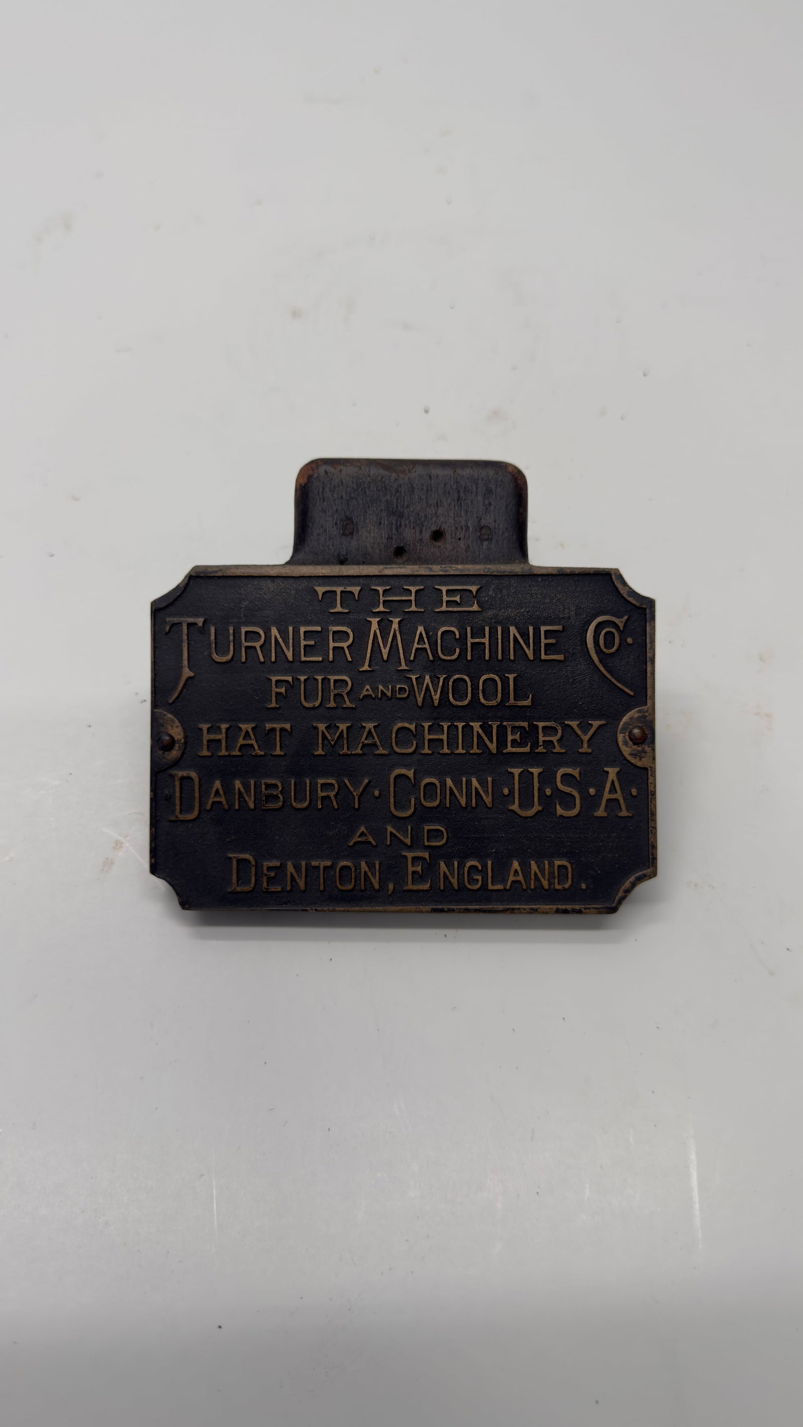 Antique Turner Machine Co. Hat Machinery Nameplate: Antique cast bronze or brass manufacturer’s nameplate from The Turner Machine Co. of Danbury, Connecticut, U.S.A., and Denton, England. Marked for Fur and Wool Hat Machinery, this industrial plaque 