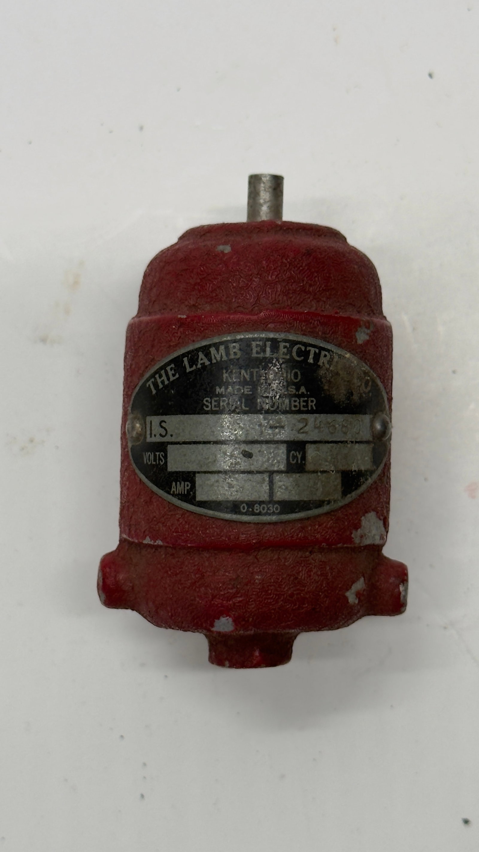 Vintage Lamb Electric Fractional HP Motor Paperweight: Vintage Lamb Electric cast metal paperweight modeled after an electric motor. Features the original red textured finish and Lamb Electric, Kent, Ohio, U.S.A. nameplate. Produced as a promotional adver