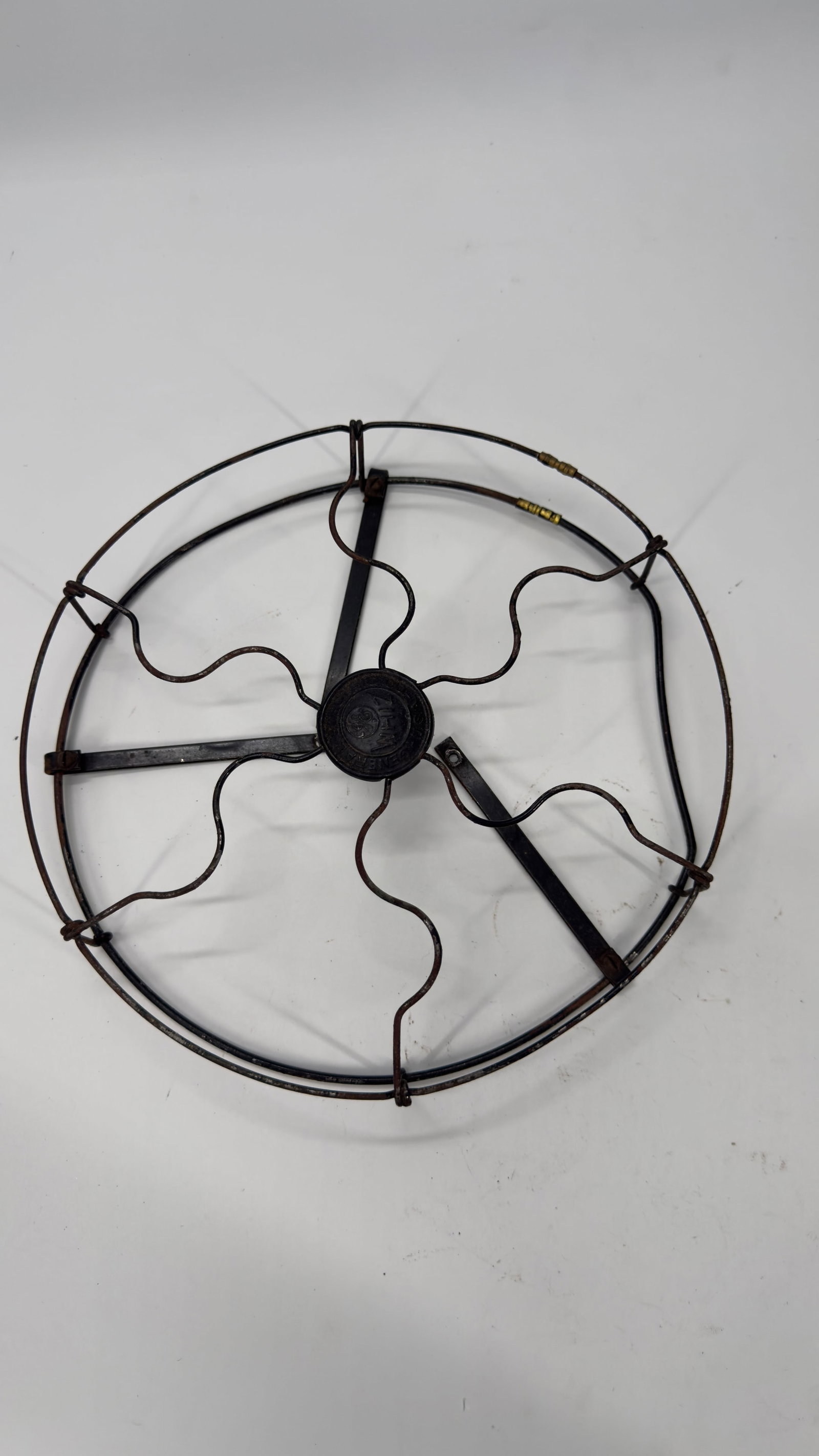 Antique GE Whiz Fan Wire Guard w/ Center Badge: Original antique General Electric Whiz fan front wire guard with embossed center hub marked “GE Whiz – General Electric U.S.A.”. Designed for an early 20th-century GE Whiz desk fan, this gua