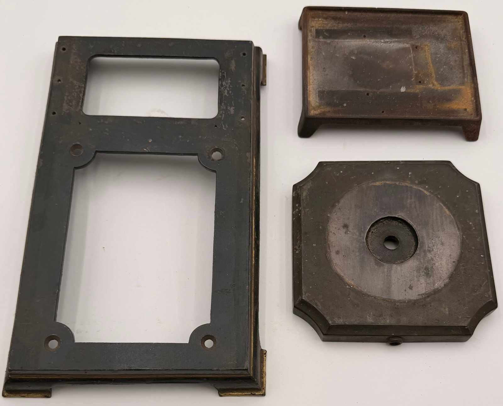 Set of 3 Vintage Cast Iron Lamp Bases: This lot includes a set of three vintage cast iron lamp bases featuring heavy metal construction and classic industrial-era styling. These bases are suitable for restoration projects, antique lighting