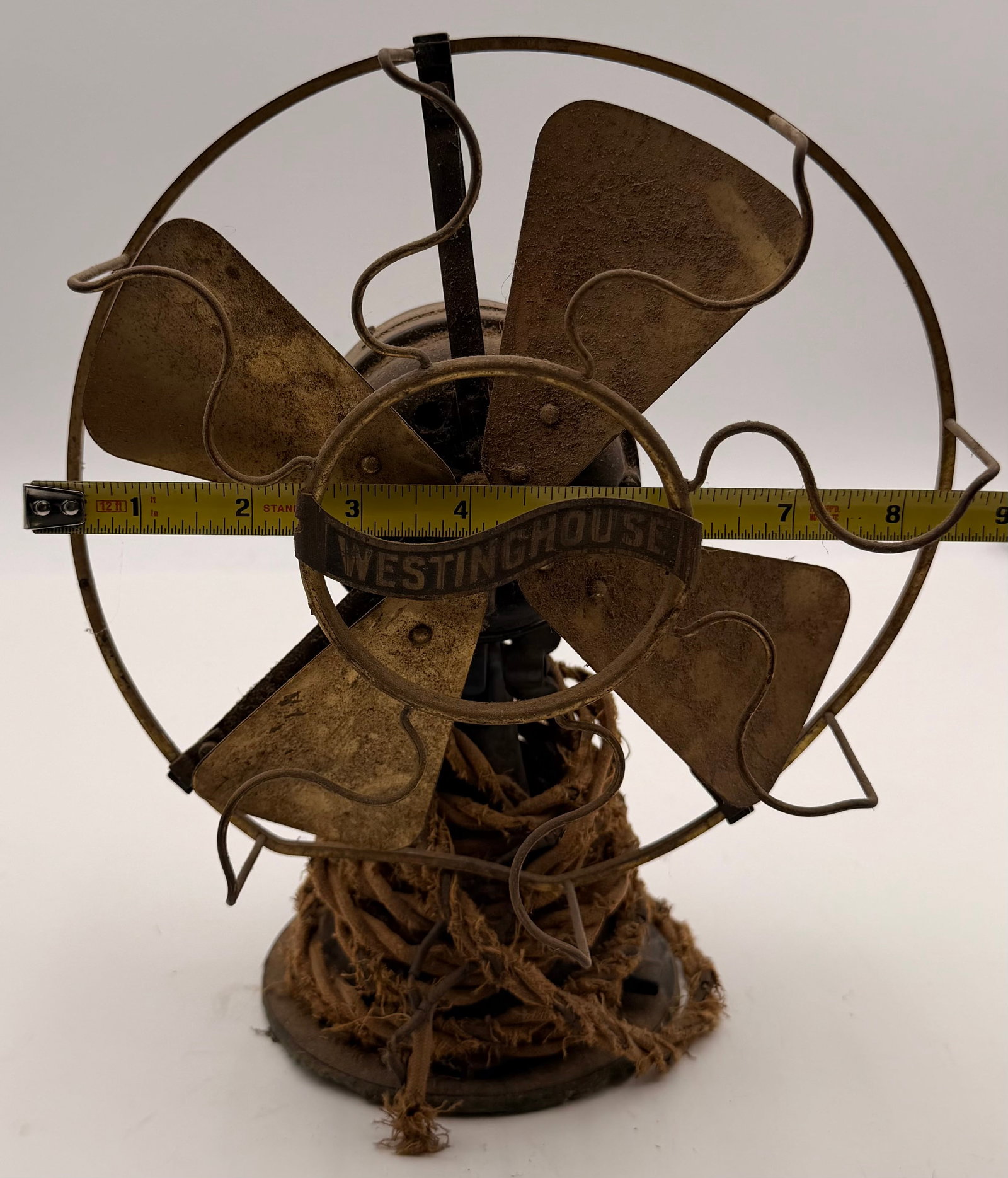 Antique Westinghouse Tank Desk Fan Brass Blades: This antique Westinghouse “Tank” style desk fan is a classic early electric fan design, likely dating to the 1910s era. It features the iconic heavy-duty motor housing, brass blade constructio