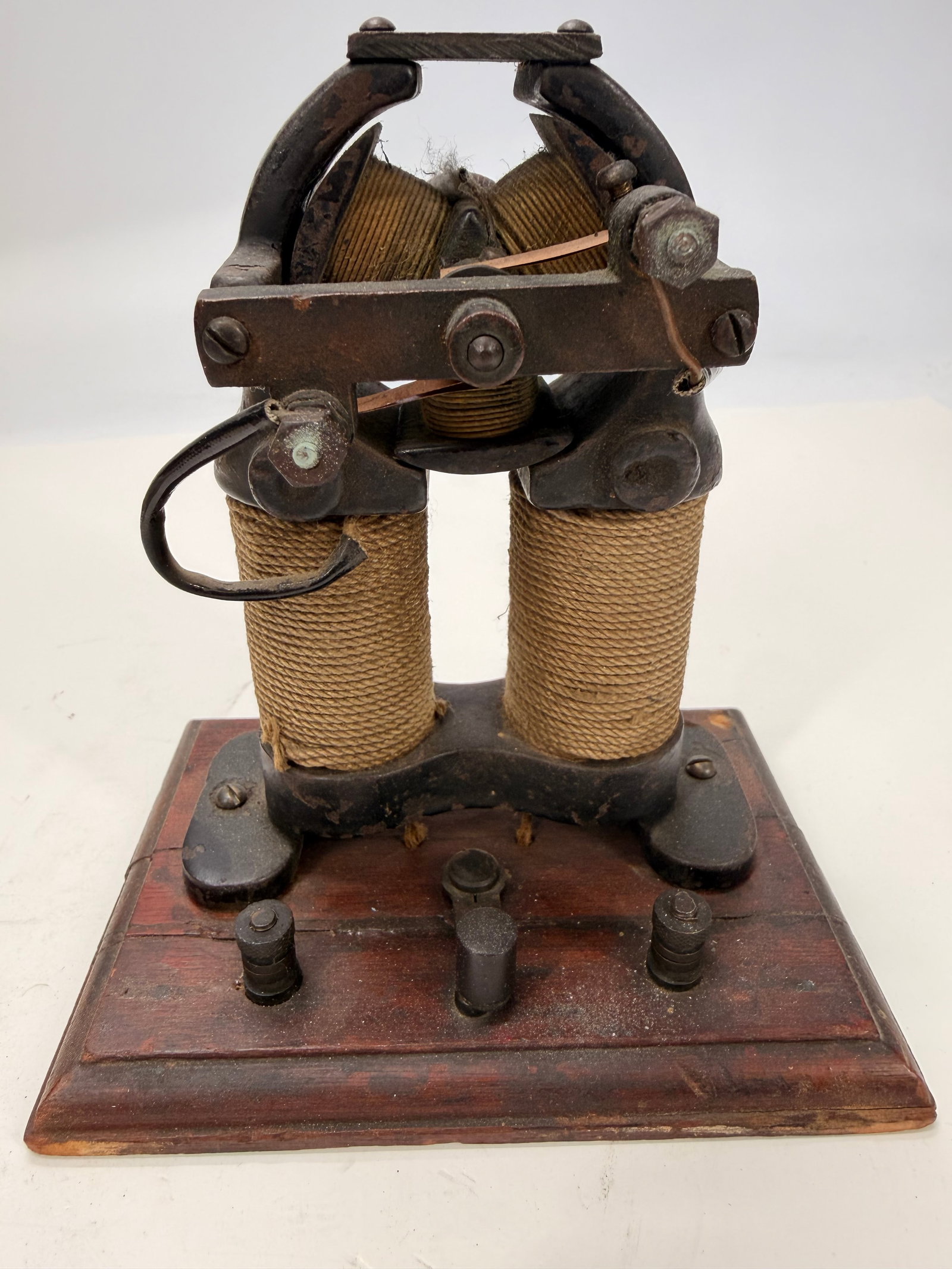 Antique Knapp No. 2 Electric Motor on Wood Base: Antique Knapp No. 2 electric motor mounted on its original wooden base, dating to the late 19th or early 20th century. Features dual cloth-wrapped electromagnet coils, cast iron frame, exposed